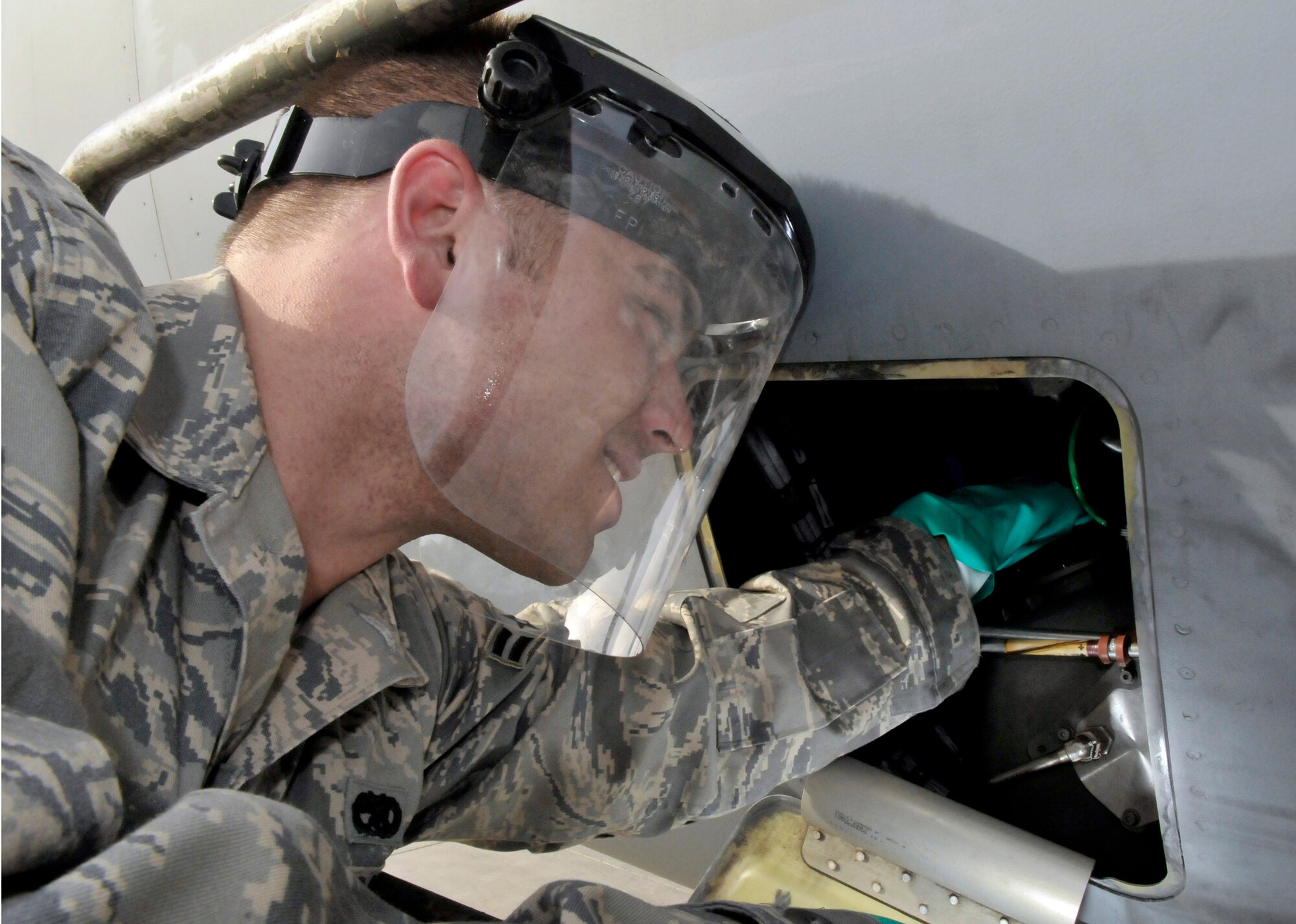 Airman 1st Class David Reynolds checks the oil on a C-17 Globemaster III engine July 12, 2010, at Joint Base Balad, Iraq. Airman Reynolds, a native of Huntley, Ill., is deployed from Joint Base McGuire-Dix-Lakehurst, N.J. (U.S. Air Force photo/Staff Sgt. Phillip Butterfield)

