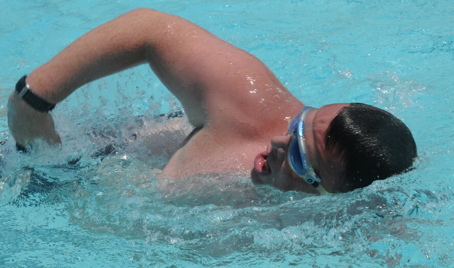 MOODY AIR FORCE BASE, Ga. -- Tech. Sgt. Philip Calkins, 41st Rescue Squadron aerial gunner instructor, swims several laps at the new outdoor swimming pool here July 9. The pool offers three lanes for lap swimmers to use. (U.S. Air Force photo by Airman 1st Class Benjamin Wiseman/RELEASED)