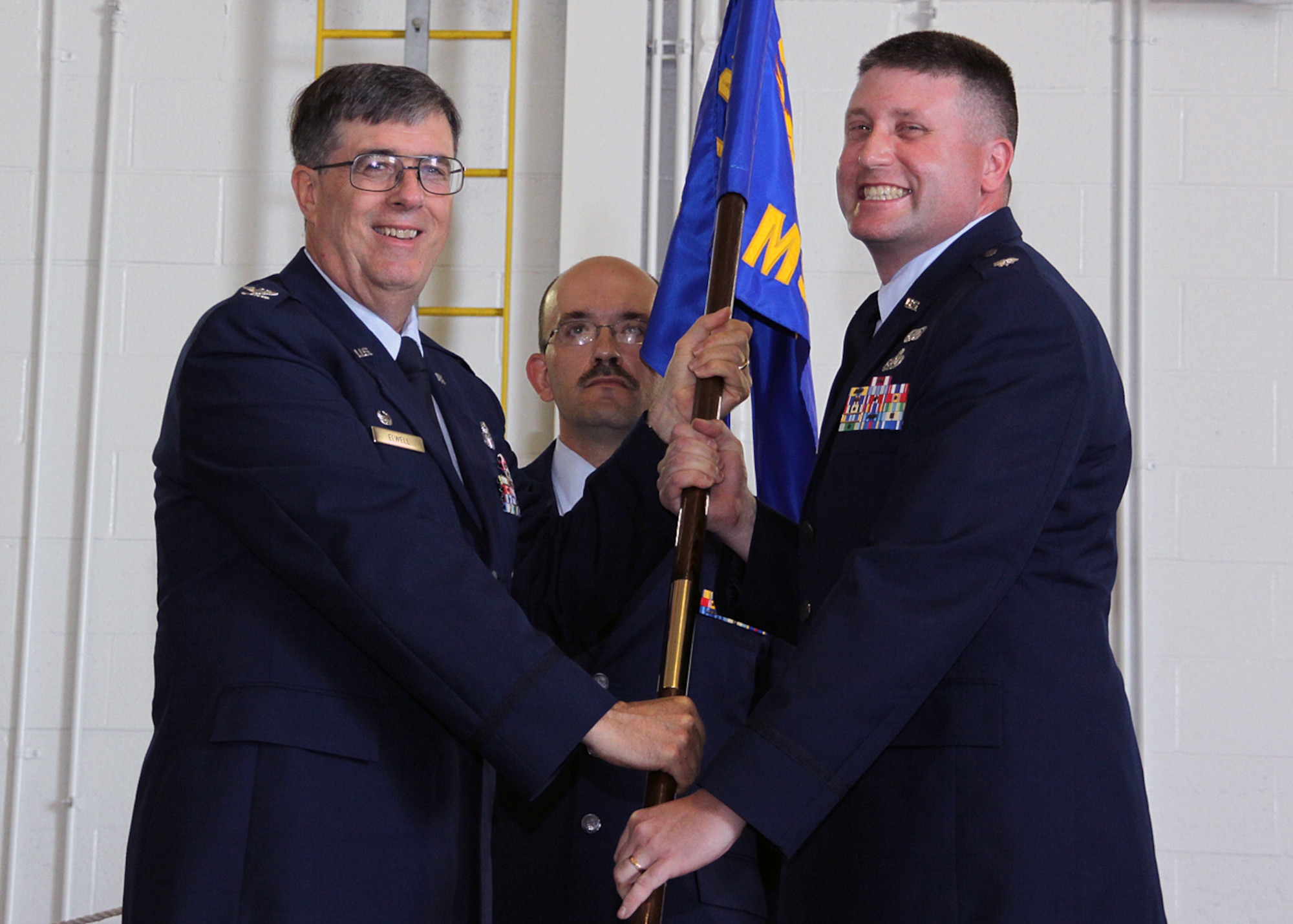 PITTSBURGH IAP ARS, PA -- (Right) Lt. Col. Patrick Ryan, incoming 911th
Mission Support Group commander, receives the 911 MSG guidon from Col.
Gordon Elwell, 911th Airlift Wing commander, during a change of command
ceremony, July 11. By receiving the guidon Colonel Ryan assumes command of
the 911 MSG. (U.S. Air Force photo/Senior Airman Joshua J. Seybert)