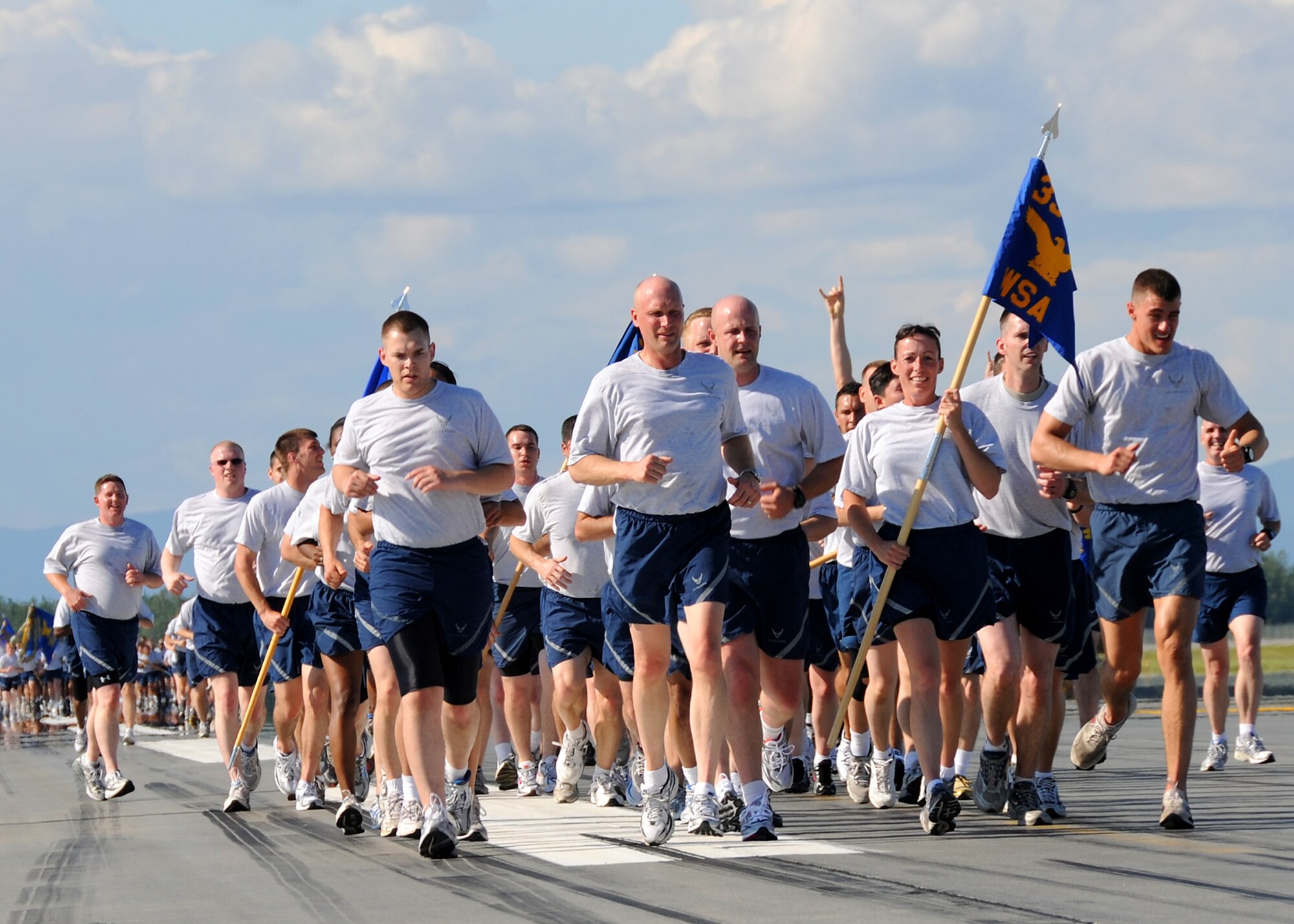Airmen of the 354th Fighter Wing Staff Agencies particpate in a fun run on the flightline July 2, 2010 at Eielson Air Force Base, Alaska.  Due to the harsh winters in Alaska, most Eielson Airmen are only able to perform physical fitness outside from May through August.  (U.S. Air Force photo/Staff Sgt. Tia Wilson)