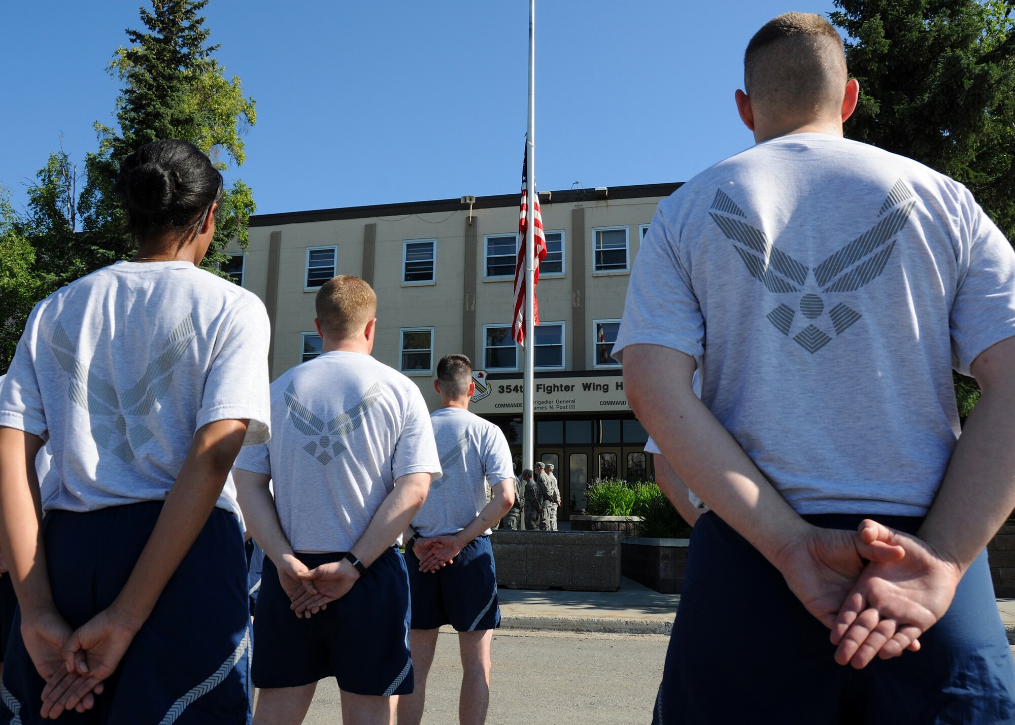 Airmen of the 354th Fighter Wing participate in retreat prior to a wing run on July 2, 2010 at Eielson Air Force Base, Alaska. The Airmen gathered for the retreat ceremony and two-mile run to celebrate Independence Day.  (U.S. Air Force photo/Staff Sgt. Tia Wilson)