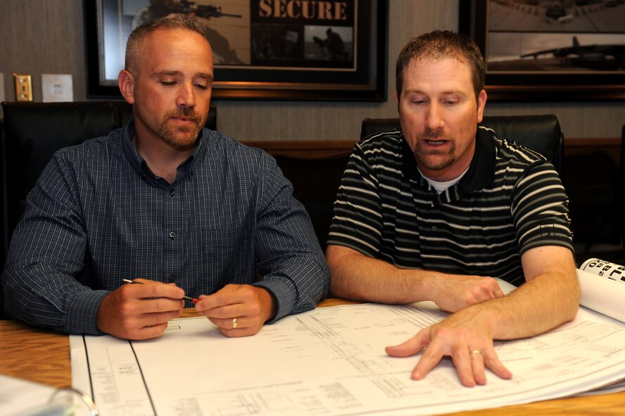 MINOT AIR FORCE BASE, N.D. -- P.J. Pallotta, 5th Bomb Wing antiterrorism officer, and Timothy Allen, 91st Missile Wing antiterrorism officer, review security procedures here June 24. Team Minot was recently selected as Air Force Global Strike Command’s 2009 Best Antiterrorism Program of the Year. (U.S. Air Force photo by Tech. Sgt. Lee A. Osberry, Jr.)