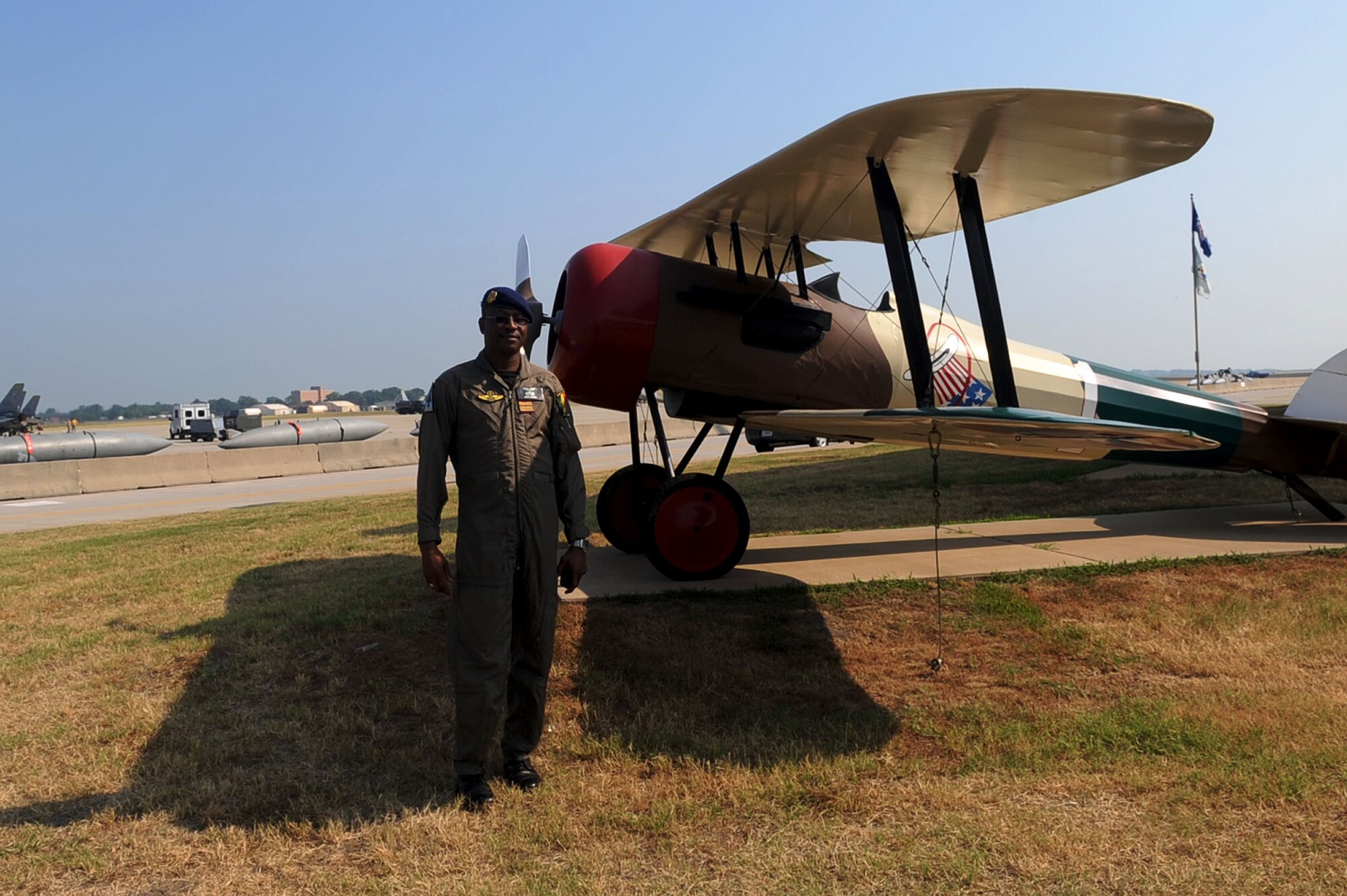 LANGLEY AIR FORCE BASE, Va – African Col. Mohamed Alpha Diaw, Malian Air Force flight surgeon, stands next to a plane display during a tour of the flight line July 15. Colonel Diaw toured the Physiology and Flight Medicine clinics in order to understand westernized aerospace medicine in hopes to improve flight safety for the African Air Force. (U.S. Air Force photo/Staff Sgt. Ashley Hawkins)(RELEASED)