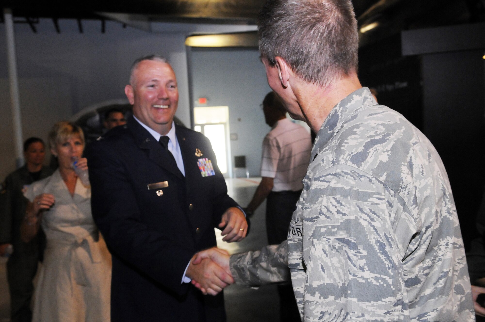 Colonel Jeffrey A. Herd,is congratulated and welcomed after becoming 116th Air Control Wing commander July 8. U. S. Air Force photo by Sue Sapp