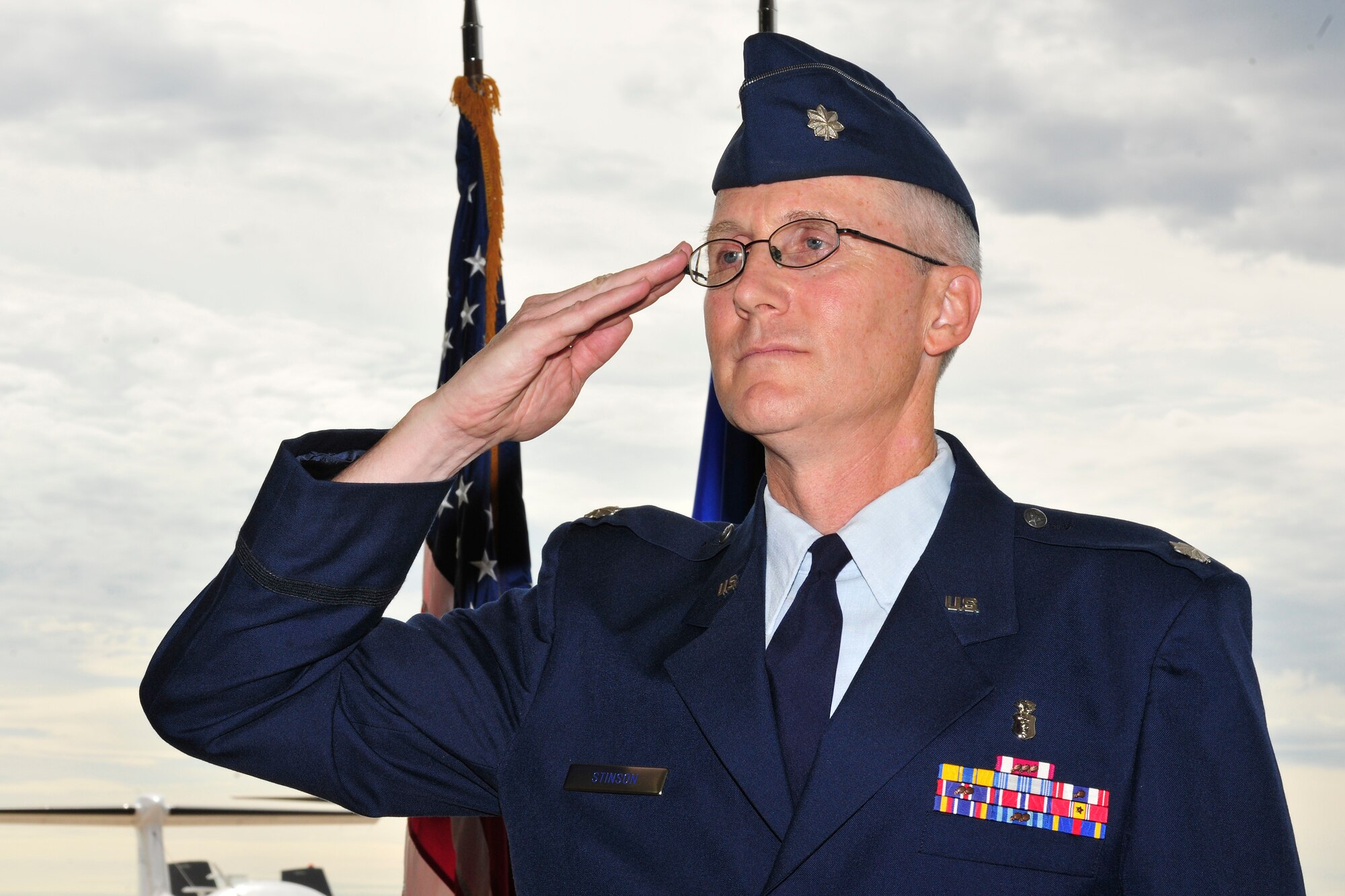 U.S. Air Force LtCol. Jeffrey Stinson, the new 27th Special Operations Aerospace Medicine Squadron commander, salutes his squadron for the first time during a change of command ceremony, July 15, 2010.  The change of command ceremony is a time-honored tradition that allows the unit to witness the old commanders relinquish their position and for new commanders to assume their roles over the squadron. (U.S. Air Force photo by Tech. Sgt. Josef Cole)(Released)

