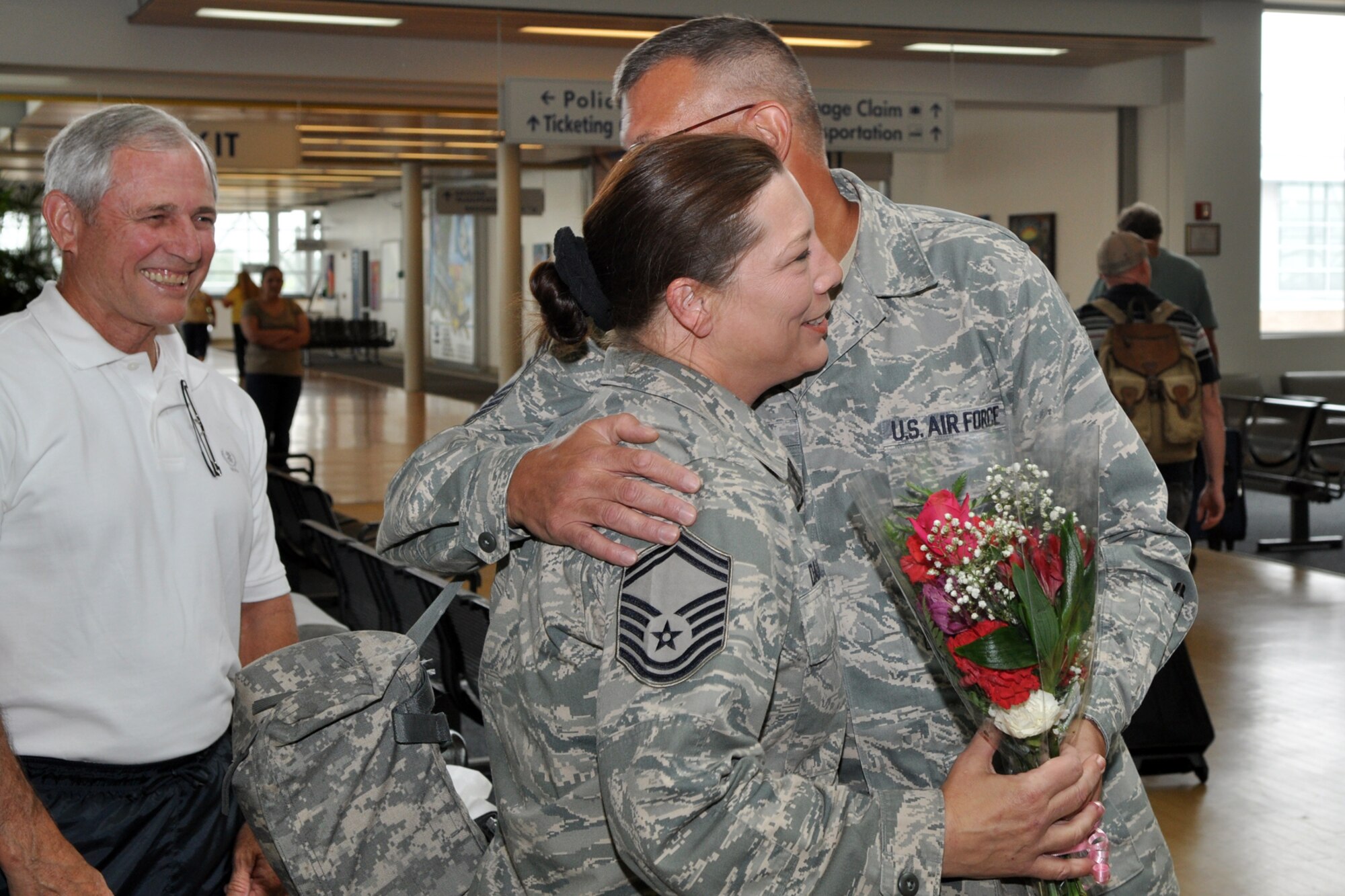 Chief Master Sgt. Keith St. Aubin, command chief, 917th Wing, greets Senior Master Sgt. Jessica D’Aurizio at the Shreveport Airport as her long time friend Chief Master Sgt. (Ret) Jack Skaggs looks on. SMSgt D’Aurizio, who is the 917th Wing’s Chief of Public Affairs, returned from a six-month tour in Afghanistan. She was welcomed back by numerous family, friends, and co-workers, as well as Col. John J. Mooney III, commander of the 917th Wing. Everyone there was extremely happy to see her return safe. (U.S. Air Force photo/Tech. Sgt. Jeff Walston)  