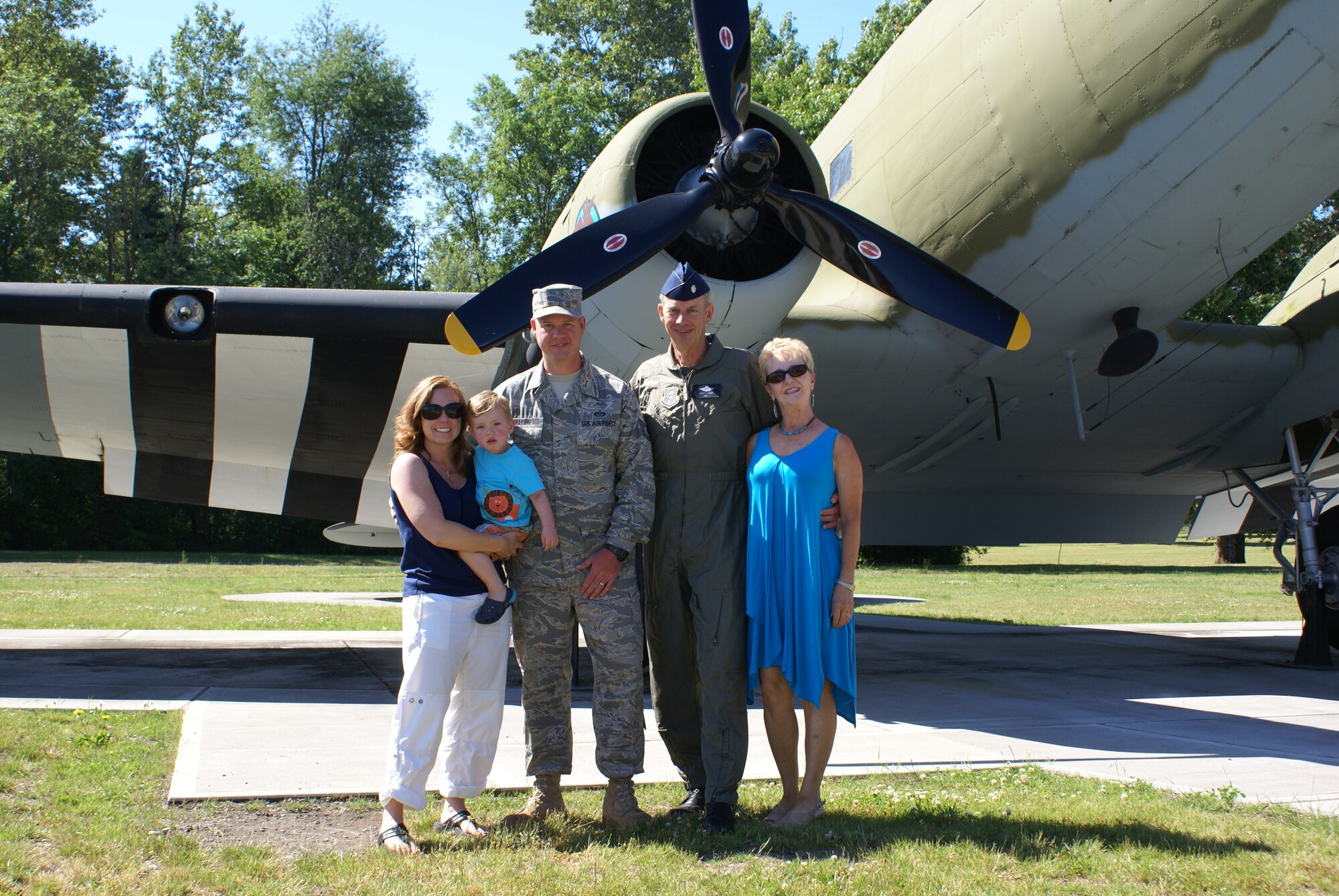 Tech Sgt. Douglas Seekins poses for a photograph with his wife,  Brandi, his son, Brody, his mother, Judi, and his father, retired Lt. Col. Scott Seekins, on Heritage Hill July 8. (U.S. Air Force photo/Amn Leah Young)