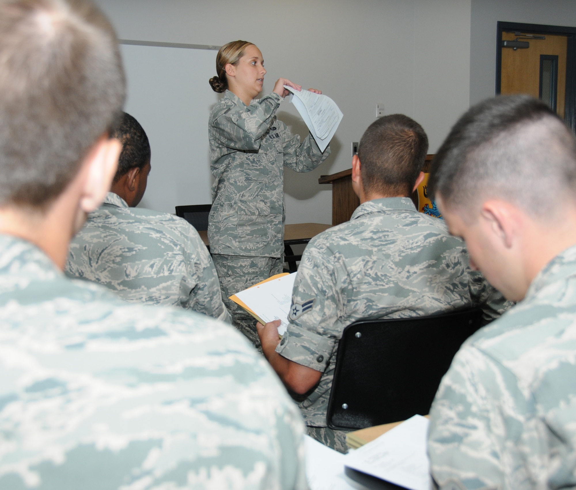 Airman 1st Class Ashley Payne conducts a short sheet briefing about assignment notification procedures to 81st Training Group students at the student personnel center in the Levitow Training Support Facility.  (U.S. Air Force photo by Kemberly Groue)