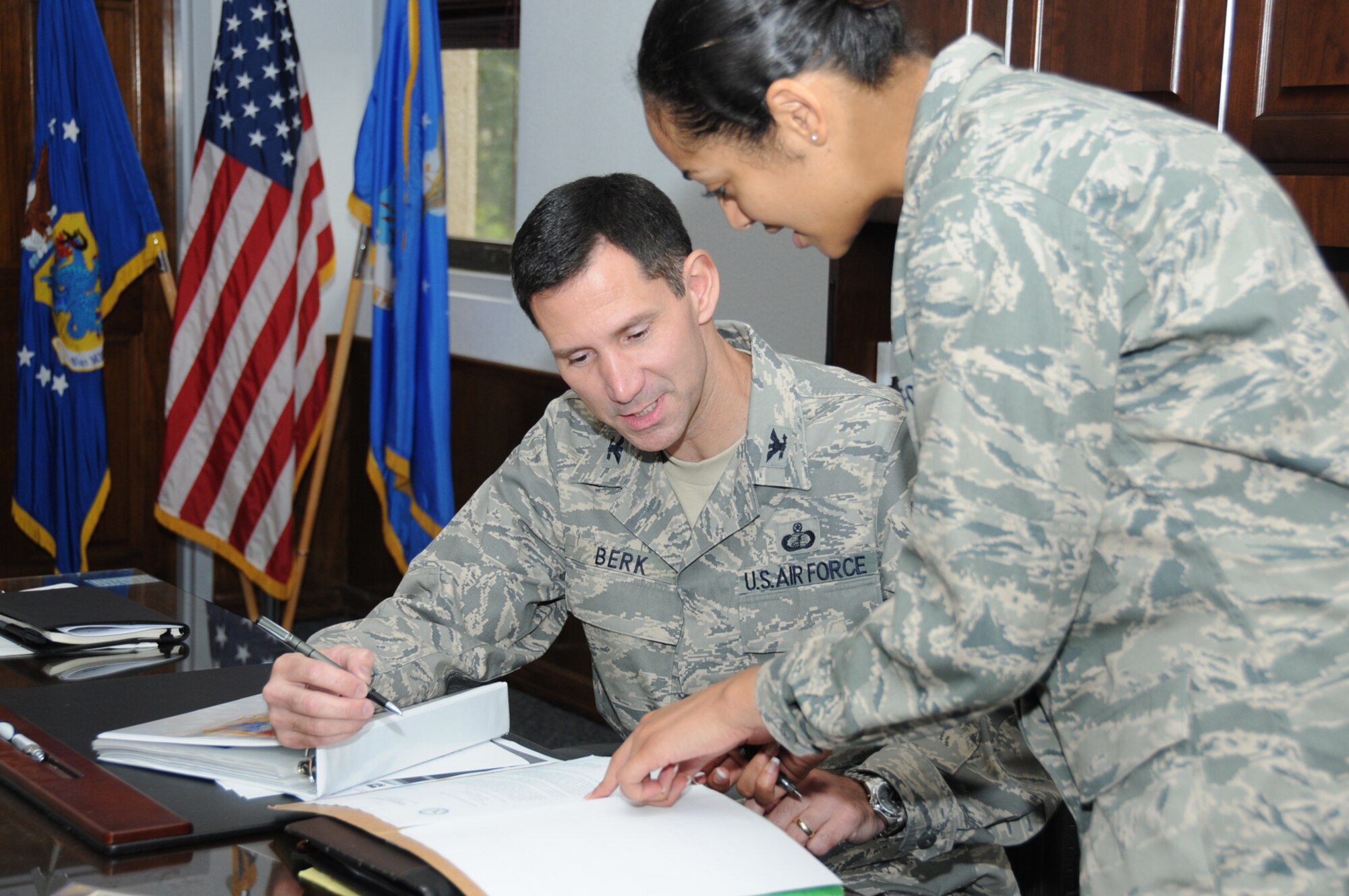 Col. Rodney Berk, new commander of the 81st Mission Support Group, reviews paperwork with 1st Lt. Stellina Anelli, his executive officer, June 29.  Colonel Berk, who most recently served as U.S. Pacific Command’s comptroller, took command of the 81st MSG June 24.  Col. Jeffrey Jackson, who commanded the 81st MSG for two years, retired with more than 25 years of military service.  (U.S. Air Force photo by Kemberly Groue)