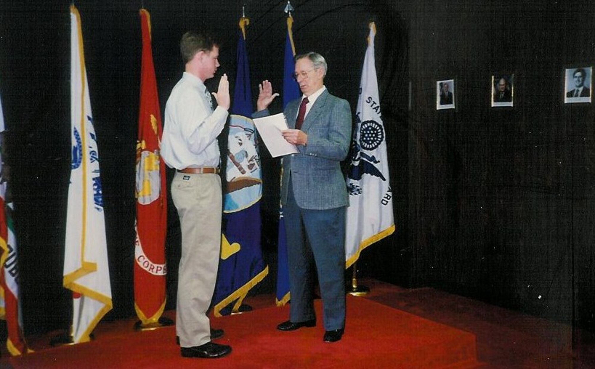 Douglas Seekins is sworn into the Air Force by his grandfather, Maj. Robert Seekins Jan. 3, 1991 in Oakland, Ca. (U.S. Air Force photo/Amn Leah Young)