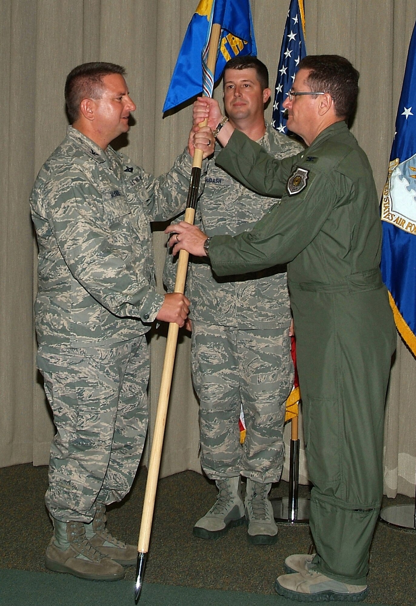 Col. Mark K. Waite (right), 505th Training Group, accepts the group's guidon from 505th Command and Control Wing Commander Col. Edward L. McKinzie during a change of command ceremony held June 25 at Hurlburt Field, Fla. Colonel Waite served as the Combat Operations Division Chief, 609th Air and Space Operations Center, Al Udeid Air Base, Qatar, prior to assuming command from Col. Christopher P. DiNenna.  The 505th TRG oversees three squadrons and provides training and system support to combatant and numbered Air Force commanders and joint and allied partners.  (U.S. Air Force photo by Keith Keel)