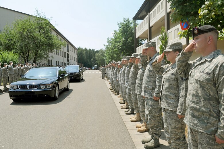U.S. Air Forces in Europe Airmen salute Gen. Roger A. Brady July 14, 2010 as he leaves the Kisling NCO Academy auditorium after receiving his Order of the Sword invitation at Kapaun Air Station, Germany. General Brady is the U.S. Air Forces in Europe commander. (U.S. Air Force photo illustration/Airman 1st Class Grovert Fuentes-Contreras) 