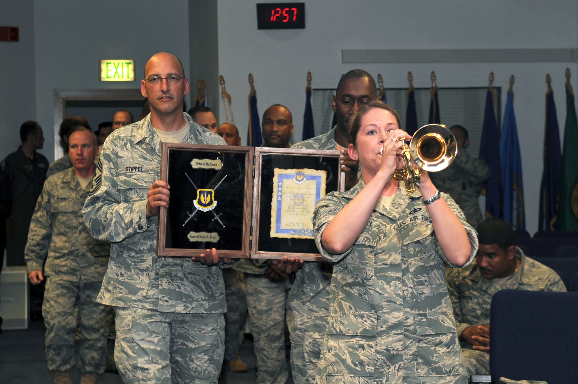 Staff Sgt. Brenna Dooley plays a trumpet before USAFE enlisted members present Gen. Roger A. Brady with an Order of the Sword invitation July 14, 2010 at the Kisling NCO Academy on Kapaun Air Station, Germany. Sergeant Dooley is a member of the U.S. Air Forces in Europe Band and General Brady is the USAFE commander. (U.S. Air Force photo/Airman 1st Class Grovert Fuentes-Contreras)