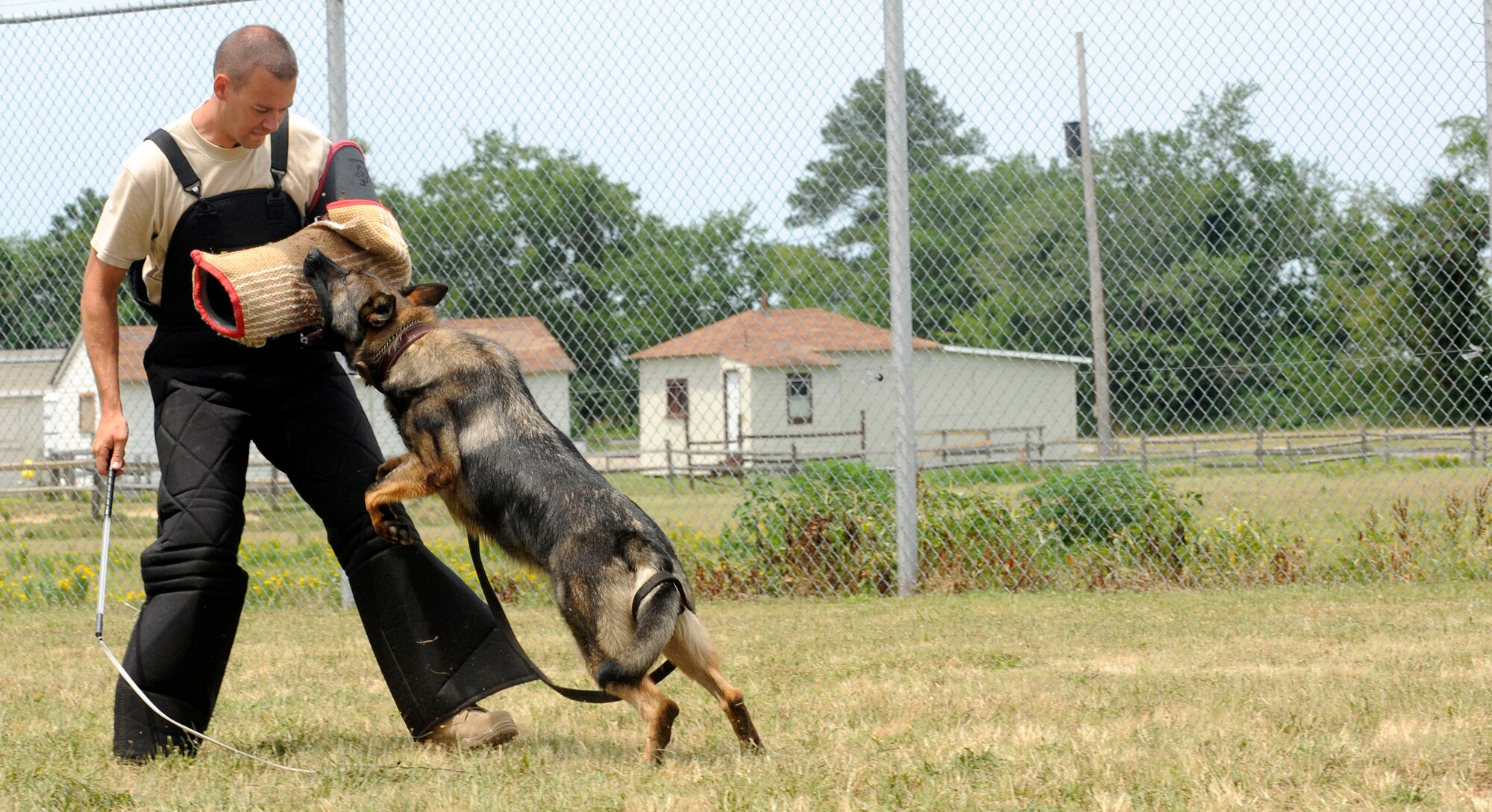 LANGLEY AIR FORCE BASE, Va. – Tech Sgt. Randy Blair, 20th Security Forces Squadron Military Working kennel master from Shaw AFB, SC., practices decoy work with MWD Nero during the Air Combat Command MWD training seminar June 29. Security forces military working dogs and their handlers from across ACC assembled at Langley for the first MWD training seminar. (U.S. Air Force photo/ Senior Airman Dana Hill)