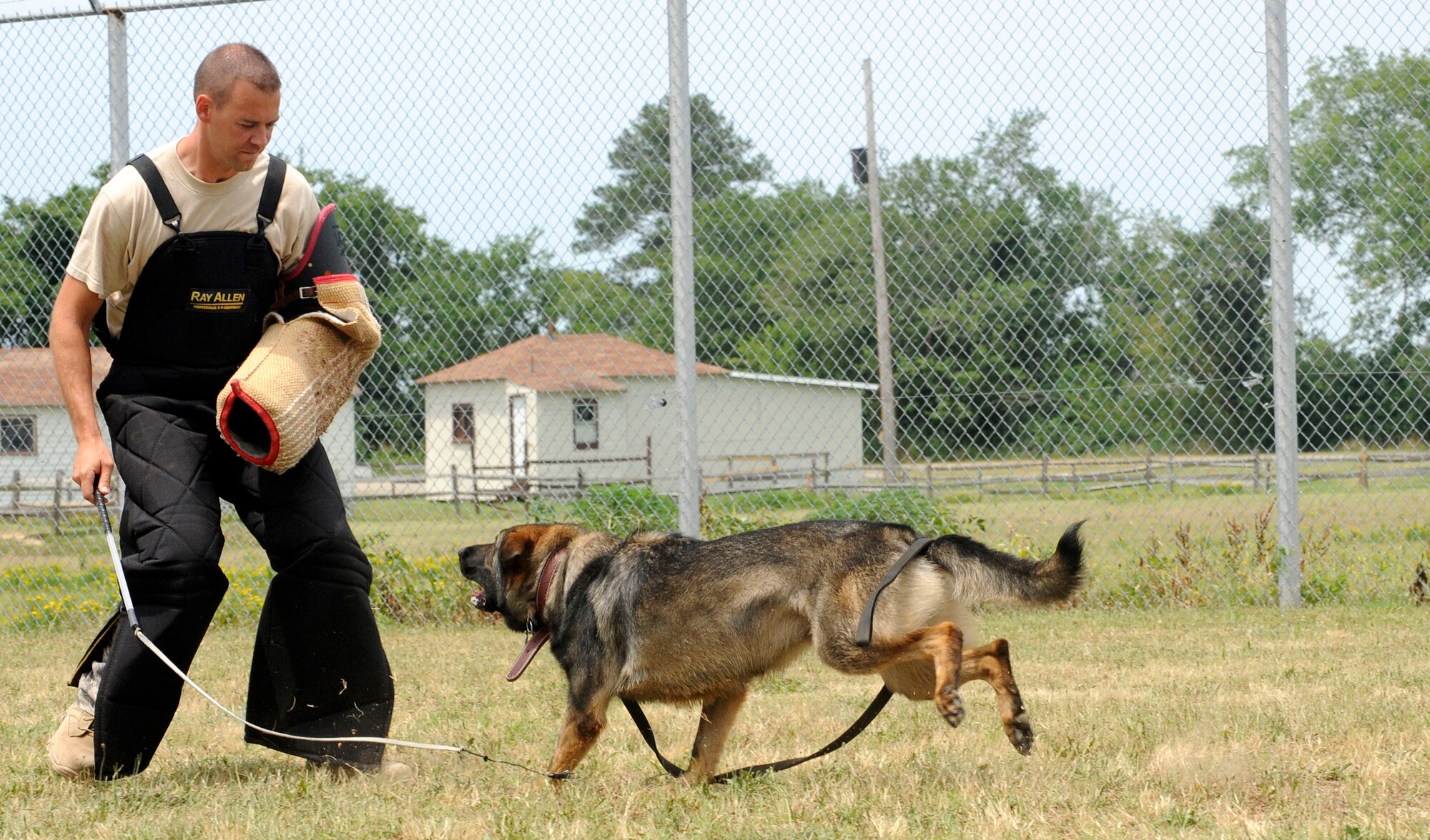 LANGLEY AIR FORCE BASE, Va. – Tech Sgt. Randy Blair, 20th Security Forces Squadron Military Working kennel master from Shaw AFB, SC., practices decoy work with MWD Nero during the Air Combat Command MWD training seminar June 29. Security forces military working dogs and their handlers from across ACC assembled at Langley for the first MWD training seminar. (U.S. Air Force photo/ Senior Airman Dana Hill)