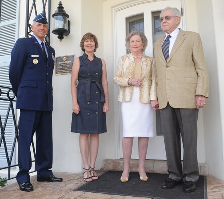 BARKSDALE AIR FORCE BASE, La. – Maj. Gen. Floyd Carpenter (left), Eighth Air Force commander, and his wife Melissa stand with Lt. Gen. Edgar S. Harris, Jr., former Eighth Air Force commander, and his wife Mary Katherine on the porch of the newly dedicated distinguished visitors Harris House, July 14. (U.S. Air Force photo by Senior Airman Alexandra M. Boutte) (RELEASED)