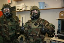 TSgt Potzgo gives the thumbs up for being able to don his Mission-Oriented Protective Posture gear in the appropriate time. During July drill weekend 916th Communication Squadron reservists practiced going from MOPP 2 to MOPP 4 in under 2 minutes, all were successful in doing so. (Photo by MSgt Mark Crary, 916CS)