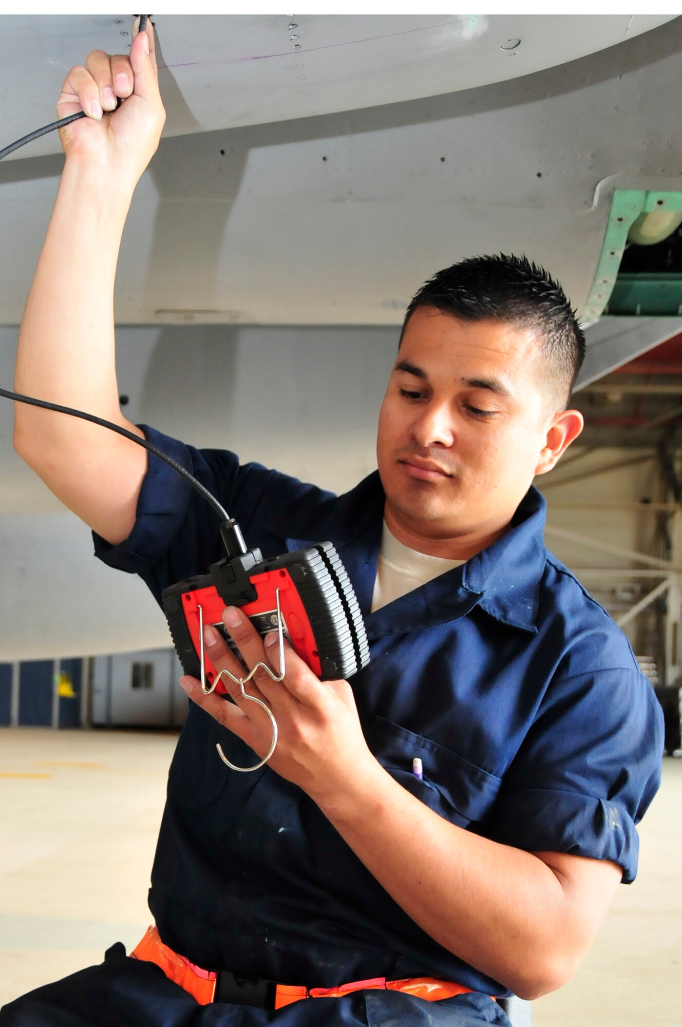 Senior Airman Jaime Carranza, 48th Equipment Maintenance Squadron aircraft structural maintenance journeyman, uses a boroscope to check for Foreign Object Damage on a F-15E aircraft July 12. Airman Carranza was nominated for a Liberty Spotlight because he displays all three core values: Integrity First, Service Before Self and Excellence in All We Do. (U.S. Air Force photo/Airman 1st Class Eboni Knox)