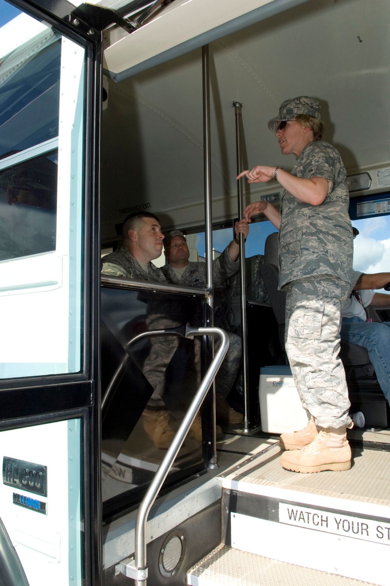 HANSCOM AIR FORCE BASE, Mass. – 1st Lt. Jenn O’Connell (standing), the installation deployment officer for the 102nd Intelligence Wing, briefs Airmen from Otis Air National Guard Base, Mass., on July 9. Thirty-six security forces personnel departed from Hanscom for pre-deployment training at Eglin Air Force Base, Fla. This is the first time a large group of troops has left from the base for an AEF CC Pax mission, allowing Hanscom’s installation deployment team to gain experience in these types of scenarios and work with other units from throughout the region. (U.S. Air Force photo by Mark Herlihy)