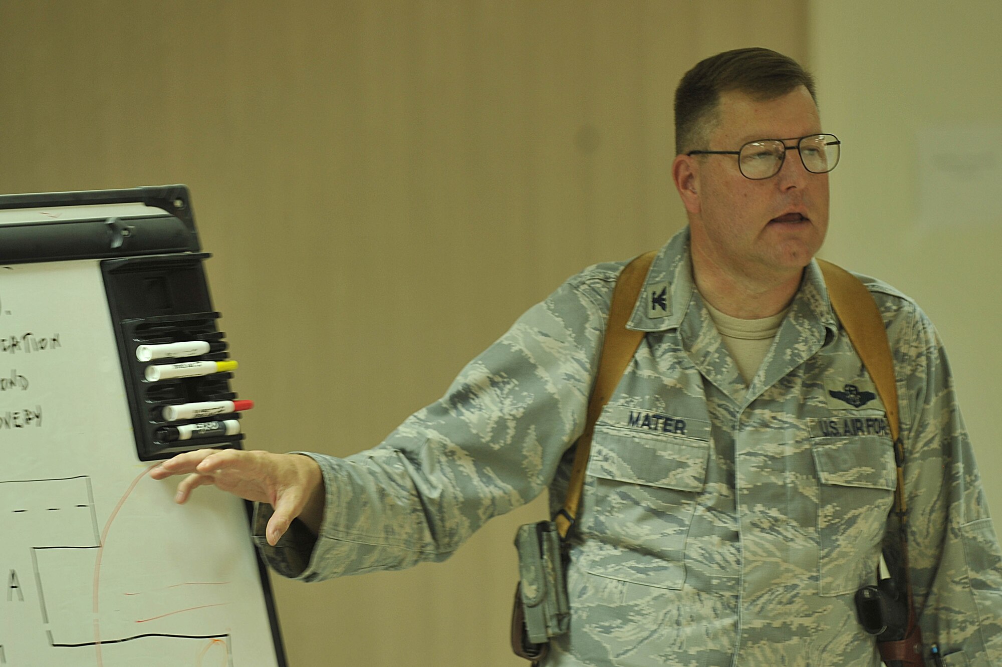 U.S. Air Force Col. Bernard Mater goes over key points during a mishap safety briefing for a command post exercise with members of the Afghan Air Force at Kandahar Airfield, Afghanistan July 7, 2010.  The briefing was a table top meeting with members of the Afghan Air Force and advisors from the 738th Air Expeditionary Advisory Group prior to a downed aircraft exercise that will be held at Kandahar Airfield, Afghanistan.  Colonel Mater is the commander of the 738 AEAG.   (U.S. Air Force photo/Staff Sgt. Quinton Russ/released)