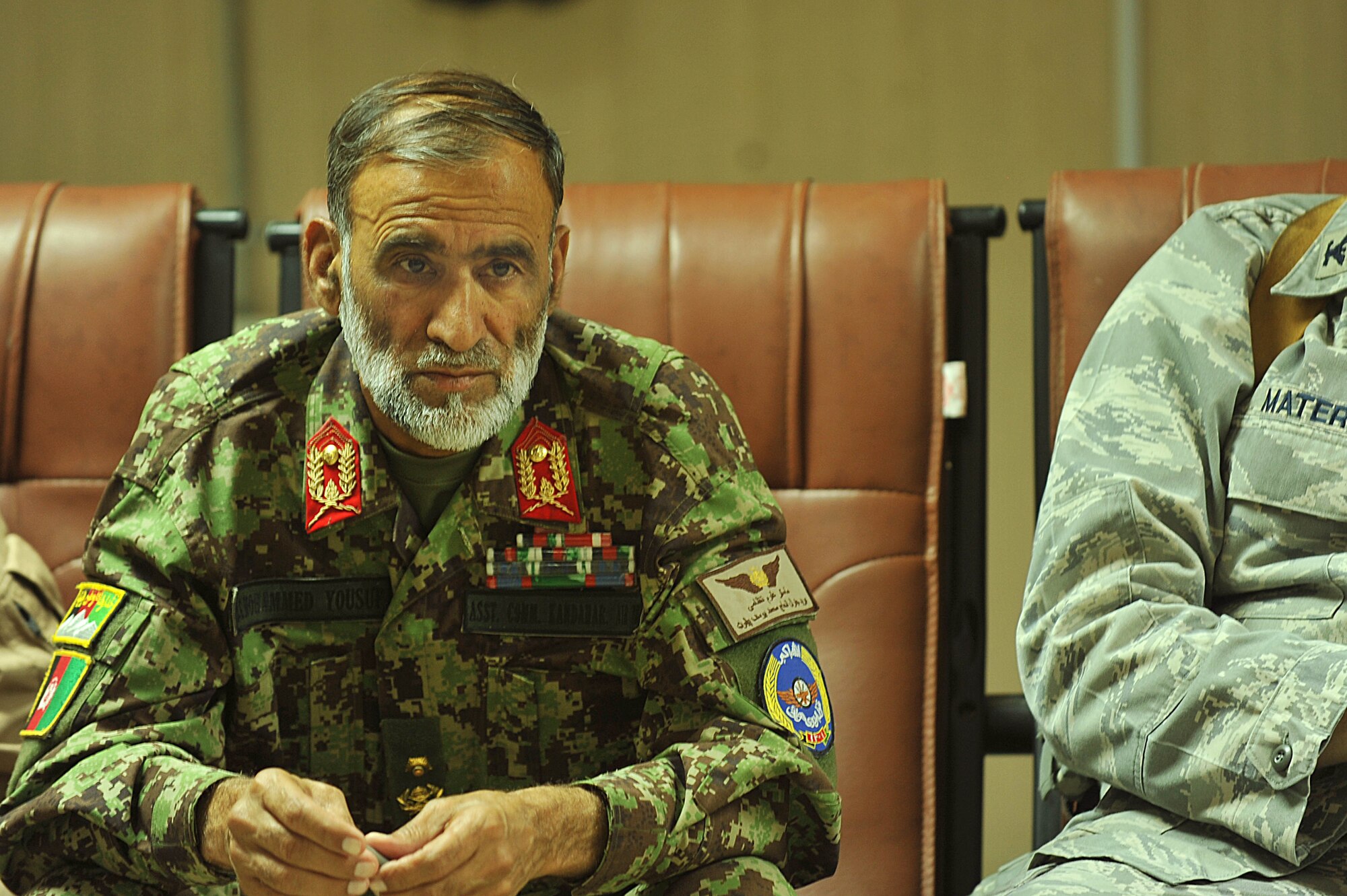 Afghan Air Force Brig. Gen. Haji Yousef listens to U.S. Air Force personnel of the 738th Air Expeditionary Advisory Group conduct a mishap safety briefing for a command post exercise at Kandahar Airfield, Afghanistan July 7, 2010.  The briefing was a table top meeting with members of the Afghan Air Force and advisors from the 738 AEAG prior to a downed aircraft exercise that will be held at Kandahar Airfield, Afghanistan.  General Yousef is the deputy commander of the Kandahar Air Wing.  (U.S. Air Force photo/Staff Sgt. Quinton Russ/released)