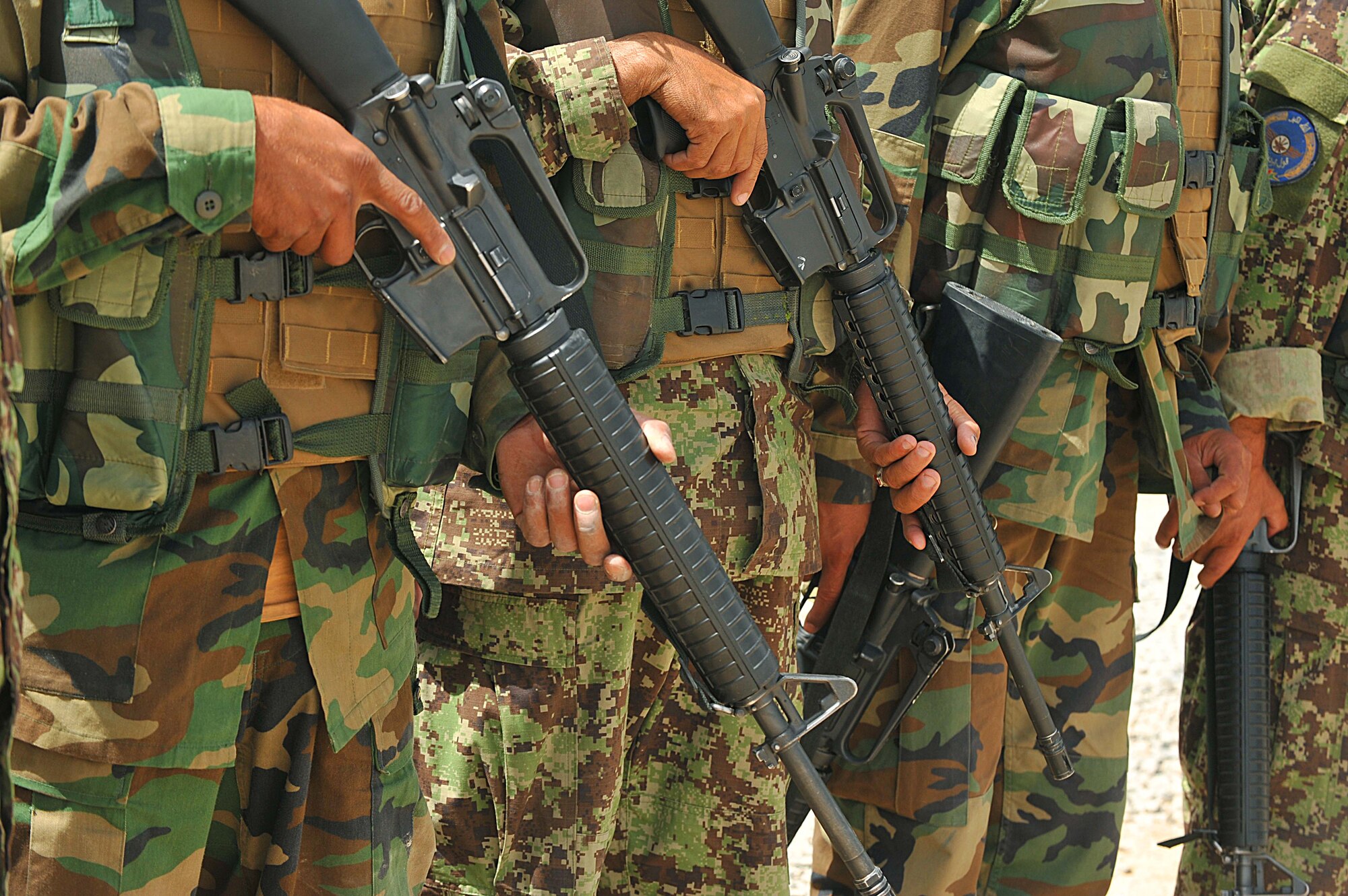 Afghan Air Force members listen as U.S. Air Force Tech. Sgt. Michael Smith teaches a class on entry control points and vehicle searches for explosive devices at Kandahar Airfield, Afghanistan June 30, 2010.  The training prepares the Afghan security forces for realistic events they may encounter while in the field.  (U.S. Air Force photo/Staff Sgt. Quinton Russ/released)