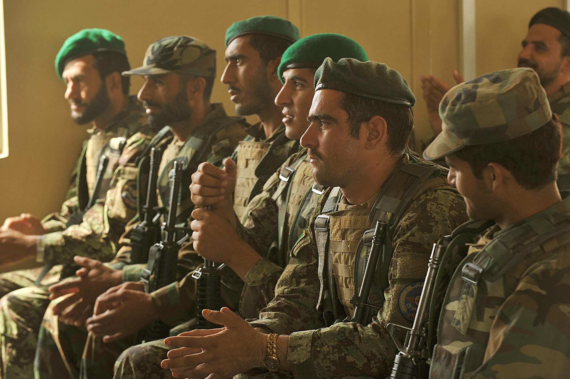 Afghan Air Force members listen as U.S. Air Force Tech. Sgt. Michael Smith teaches a class on entry control points and vehicle searches for explosive devices at Kandahar Airfield, Afghanistan June 30, 2010.  The training prepares the Afghan security forces for realistic events they may encounter while in the field.  (U.S. Air Force photo/Staff Sgt. Quinton Russ/released)