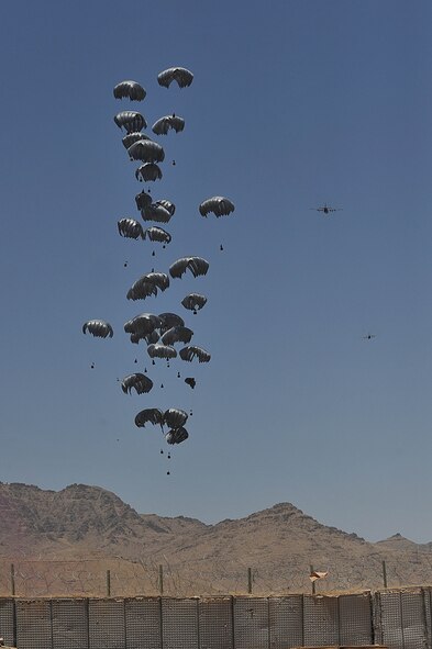 A C-130 Hercules airdrops supplies to troops at Forward Operating Base Tycz, Afghanistan, on June 29, 2010. The 738th Air Expeditionary Advisory Group conducted Mi-17 missions in the area and is responsible for training and mentoring the Afghanistan National Army Air Force. (U.S. Air Force Photo/Staff Sgt. Quinton Russ) 