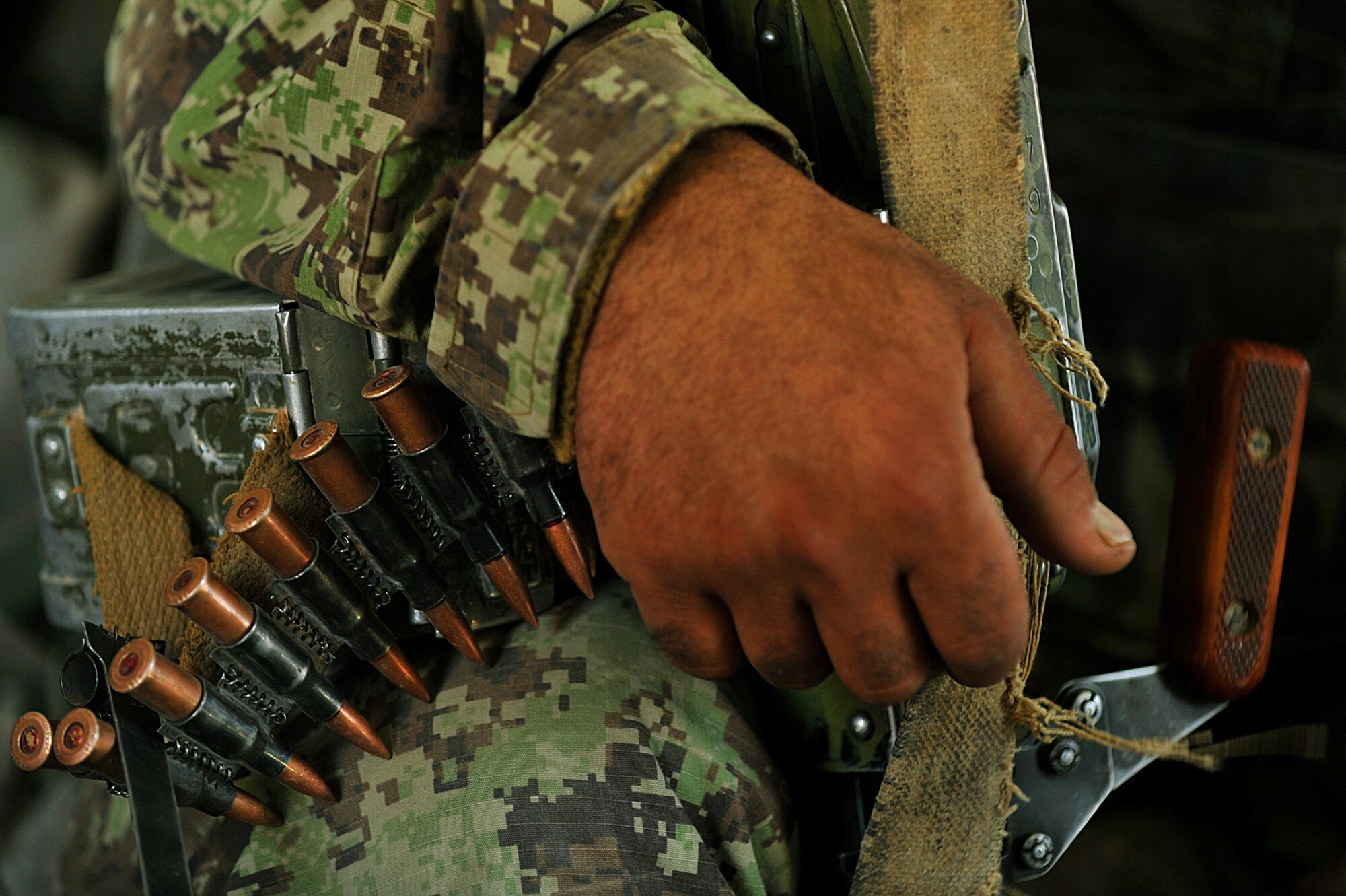An Afghan Air Force airman rides in an Mi-17 helicopter to forward operating base Tycz, Afghanistan June 29, 2010.  Members of the 738th Air Expeditionary Advisory Group are responsible for training and mentoring the Afghanistan National Army Air Force. (U.S. Air Force photo/Staff Sgt. Quinton Russ/released)