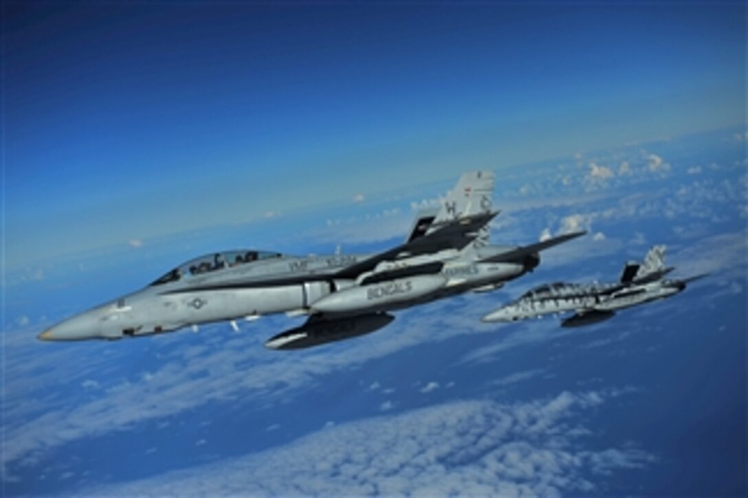 Two U.S. Marine Corps F/A-18 Hornet aircraft assigned to Marine All Weather Fighter Attack Squadron 224 from Marine Corps Air Station Beaufort, S.C., fly a mission over the Pacific Ocean during the 2010 Rim of the Pacific exercise on July 12, 2010.  Rim of the Pacific is the world's largest multinational maritime exercise drawing more than 20,000 participants from 14 nations to the waters around the Hawaiian Islands.  