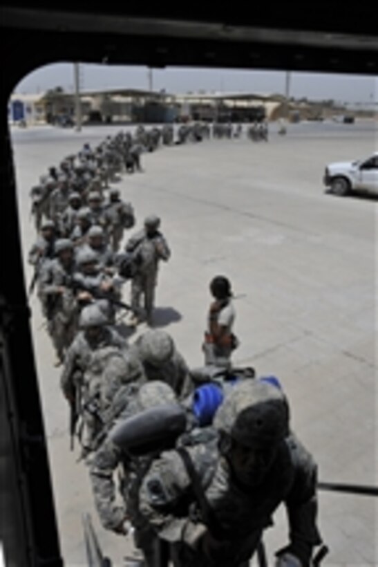 U.S. Army soldiers from Charlie Company, 67th Signal Battalion stationed at Fort Gordon, Ga., board a C-17 Globemaster III aircraft at Sather Air Base in Iraq on July 10, 2010.  The aircraft is from the 817th Expeditionary Airlift Squadron out of Incirlik Air Base, Turkey, and deployed from Charleston Air Force Base, S.C.  Charlie Company is redeploying to their home unit as part of the drawdown to 50,000 troops in Iraq by August 31, 2010.  