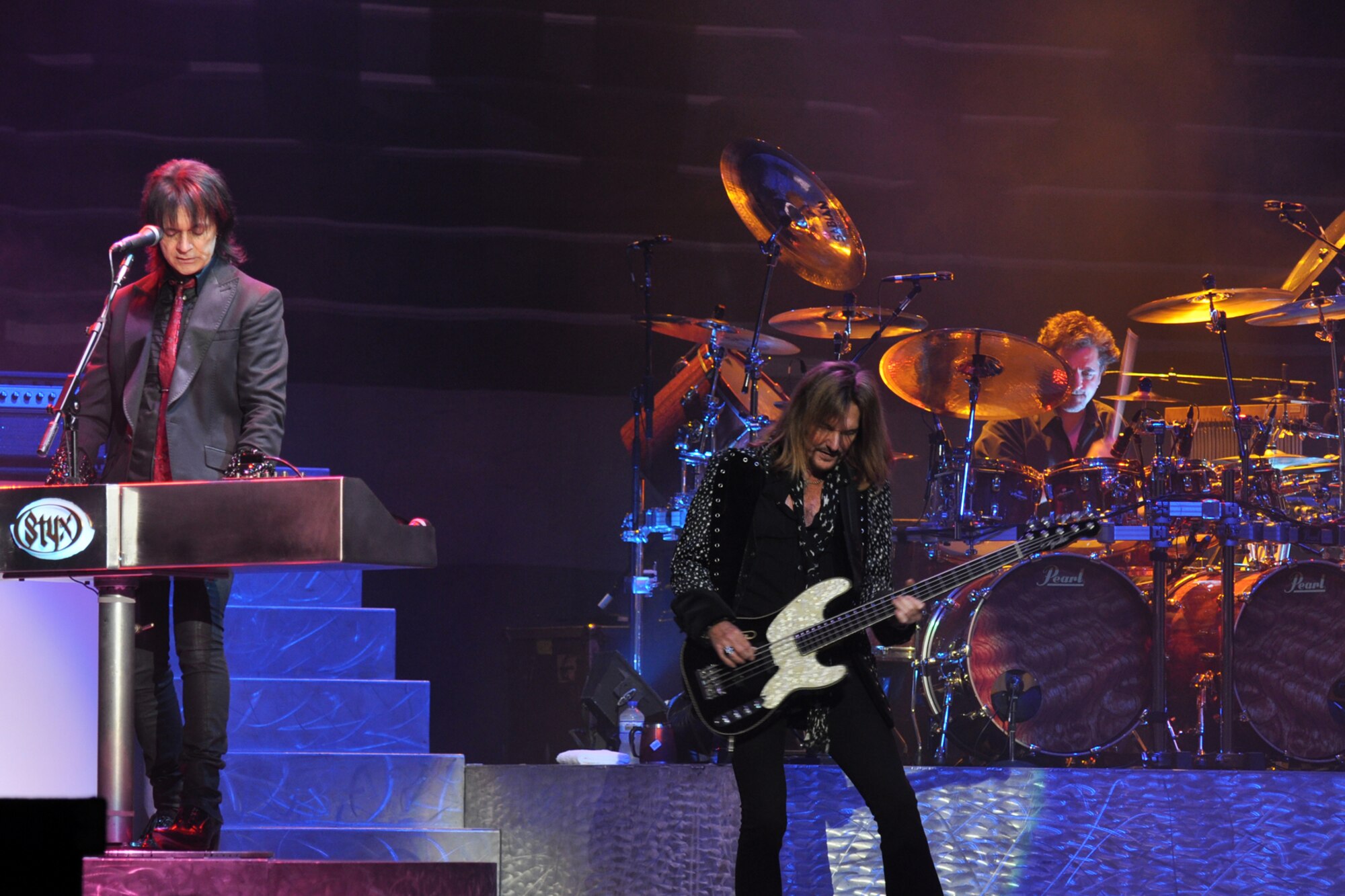 Lawrence Gowan, Ricky Phillips and drummer Todd Sucherman, all members of the legendary rock band, Styx, entertain the crowd during a concert at the CenturyTel Arena, Bossier City, La., July 4, 2010. To celebrate Independence Day and honor the men and women serving our nation at home and overseas, the Air Force Reserve Command sponsored a free concert for any member of the Armed Forces and their immediate families. Best known for their chart topping power ballads such as "Renegade," "Blue Collar Man," and "Too Much Time on My Hands," Styx has performed to sold out audiences around the world. Former U.S. Air Force Sergeant Billy Bretherton, star of the hit television show “Billy the Exterminator,” emceed the event. (U.S. Air Force photo/Tech. Sgt. Jeff Walston)