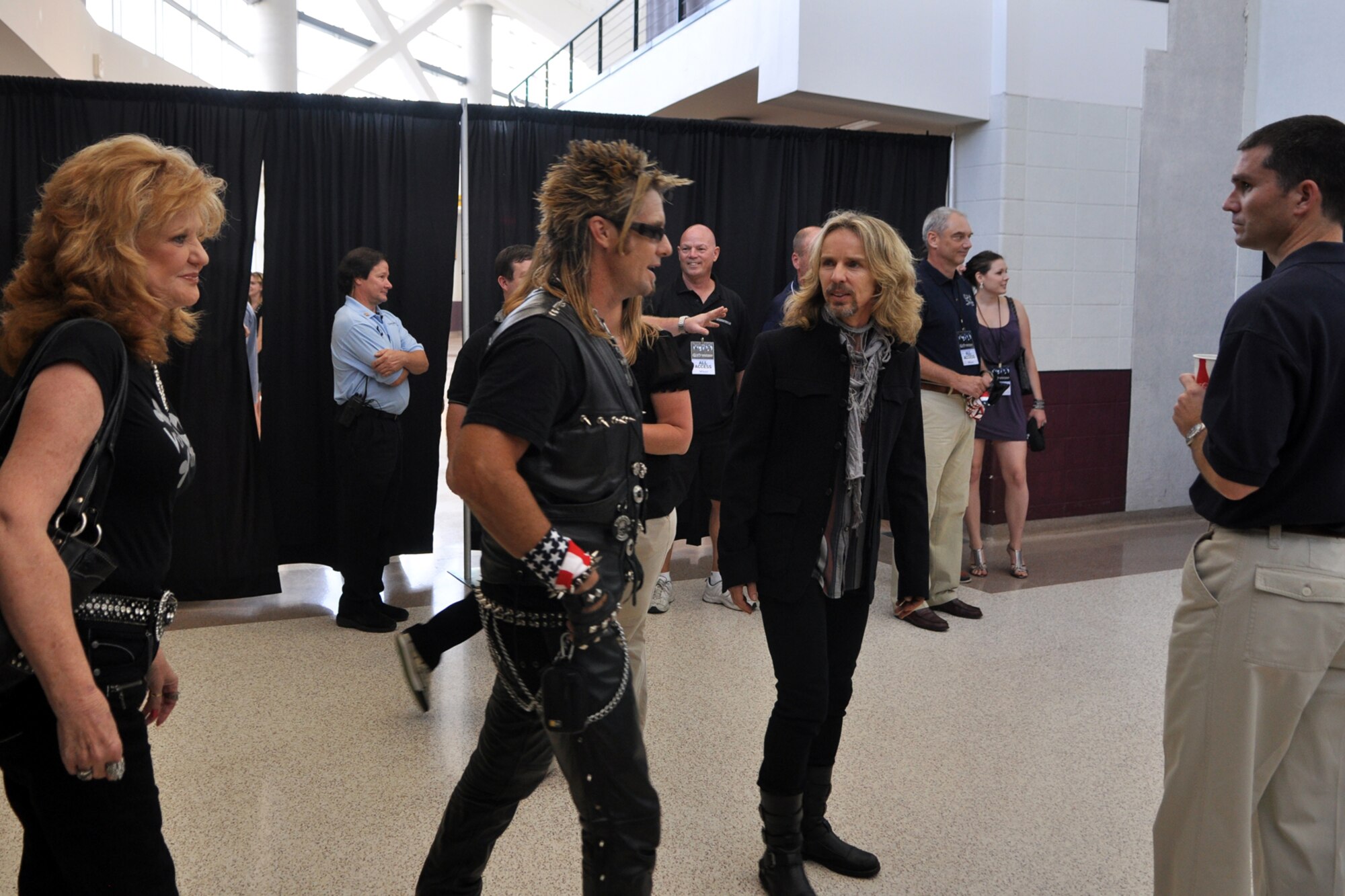 Billy Bretherton, sporting a classic studded vest, speaks with Tommy Shaw, of the legendary rock band, Styx, before taking pictures with fans at the CenturyTel Arena, Bossier City, La., July 4, 2010. To celebrate Independence Day and honor the men and women serving our nation at home and overseas, the Air Force Reserve Command sponsored a free concert for any member of the Armed Forces and their immediate families. Best known for their chart topping power ballads such as "Renegade," "Blue Collar Man," and "Too Much Time on My Hands," Styx has performed to sold out audiences around the world. Former U.S. Air Force Sergeant Billy Bretherton, star of the hit television show “Billy the Exterminator,” emceed the event. (U.S. Air Force photo/Tech. Sgt. Jeff Walston)