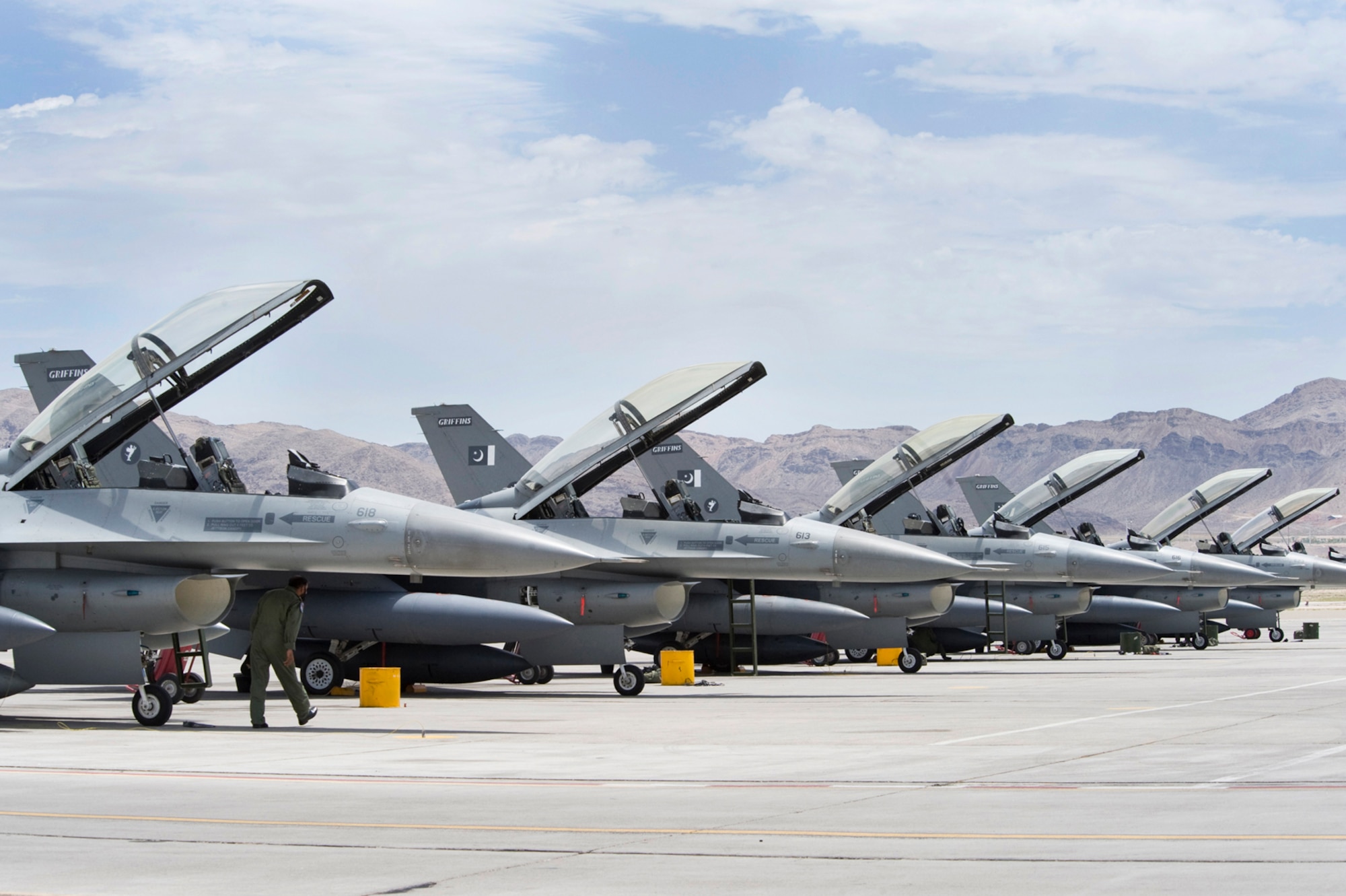 NELLIS AIR FORCE BASE, Nev.-- A Pakistan Air Force crew chief performs a post flight inspection on a F-16 Falcon after pilots and the aircraft arrive for Red Flag 10-4 July 16.  The U.S. Air Force is hosting approximately 100 Pakistan Air Force pilots, maintainers and support personnel at Nellis Air Force Base for the world's premier large force employment and integration exercise July 17-31. This is the Pakistan Air Force's first time participating in Red Flag. (U.S. Air Force Photo by Lawrence Crespo)
