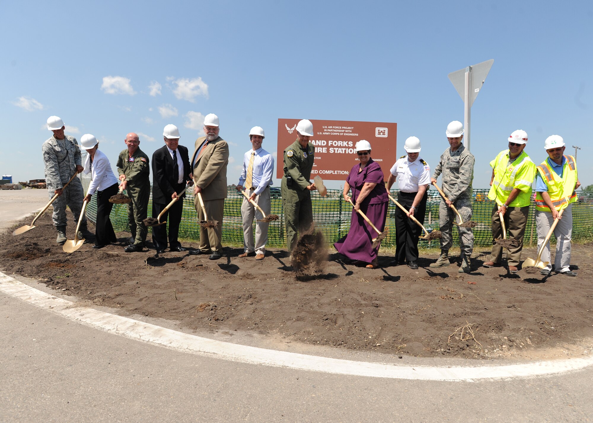 Col. Don Shaffer (center), 319th Air Refueling Wing commander, and other special guests, shovel dirt during a ground breaking ceremony for Grand Forks Air Force Base’s new fire station. The construction project will cost $13 million and is scheduled to be complete by March 2011. (U.S. Air Force photo by Staff Sgt. Suellyn F. Nuckolls)