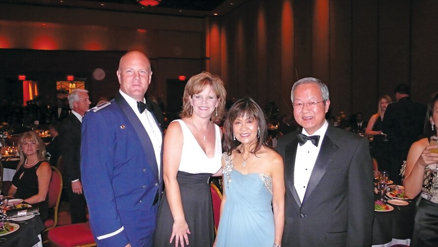 Lt. Col. Stephen Granger, former 425th Fighter Squadron commander, wife, Kim, Doris Ong, 425th Fighter Squadron honorary commander, and husband, Dr. Hong-Kee Ong, pose for a photo a the 2009 Air Force Ball. (Courtesy photo)