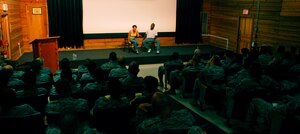 SOTO CANO AIR BASE, Honduras --  As the stereotypes of males and females get turned on their head, members of Joint Task Force-Bravo watch the "Sex Signals" show at the base theater July 14. Actors Kyle Terry and Courtney Abbott used scripted and improvisational comedy to deliver the message that it's up to each individual to stop sexual assault. (U.S. Air Force photo/Tech. Sgt. Benjamin Rojek)