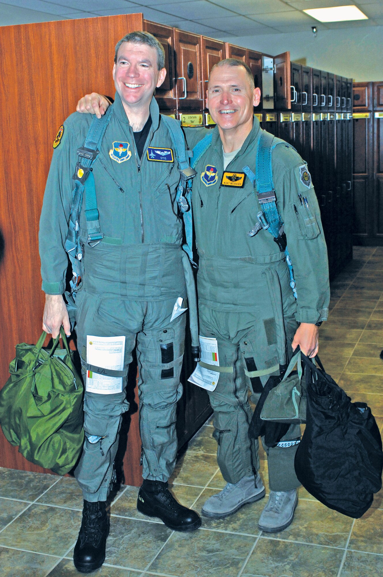 Charley Freericks, DMB Associates, Inc. vice president and 56th Fighter Wing honorary commander, and Brig. Gen. Kurt Neubauer, 56th Fighter Wing commander, pose for a photo prior to an F-16 orientation flight. (Courtesy photo)