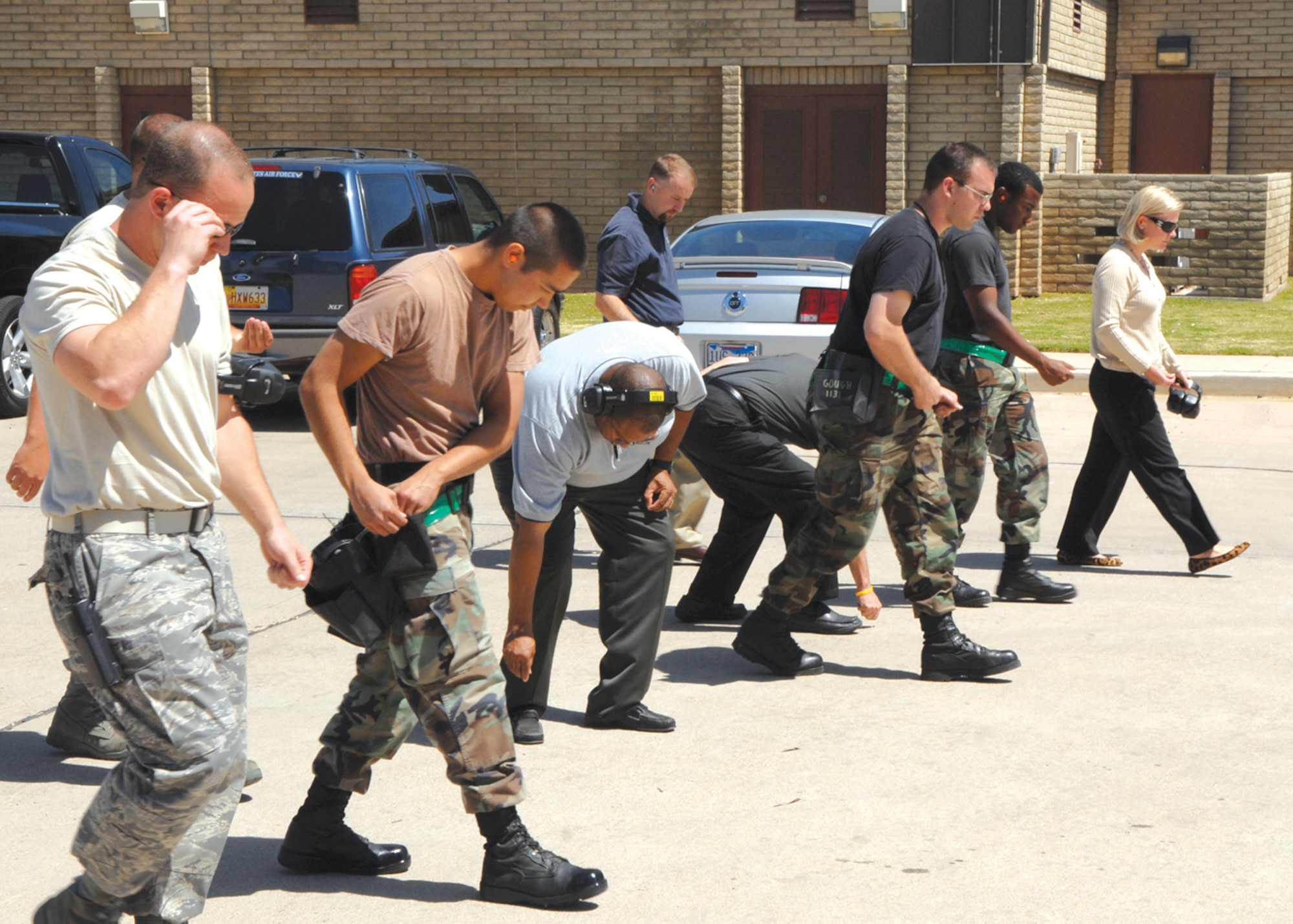 Honorary commanders participate in a foreign object debris walk.  (Courtesy photo)