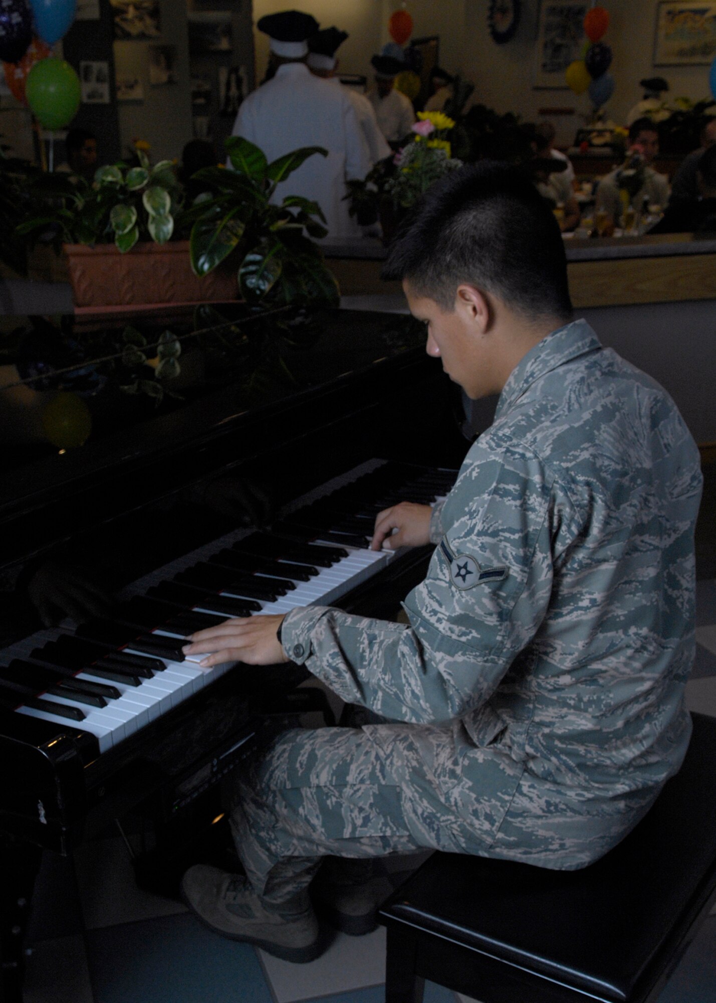 VANDENBERG AIR FORCE BASE, Calif. – Airman Efrain Ramos, of the 381st Training Squadron, leads others in the ‘Birthday Song’ at a quarterly birthday celebration at Breakers Dining Facility here Wednesday, July 14, 2010. Ramos joined other from the Vandenberg community in a birthday celebration hosted by the base. (U.S. Air Force photo/Airman 1st Class Lael Huss)