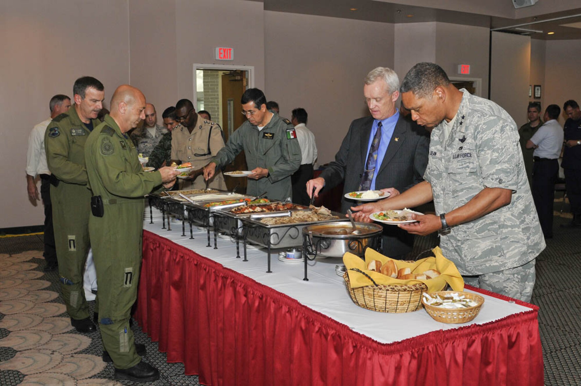 Maj. Gen. Garry C. Dean, Air Forces Northern commander (far right) initiates the lunch buffet during the North American Regional Air Chiefs Conference held at Tyndall AFB, Fla., July 12-15, 2010.  “Our aim, through open and frank discussions, was to positively impact regional air domain issues,” said General Dean.  (U.S. Air Force photo by Lisa Norman)