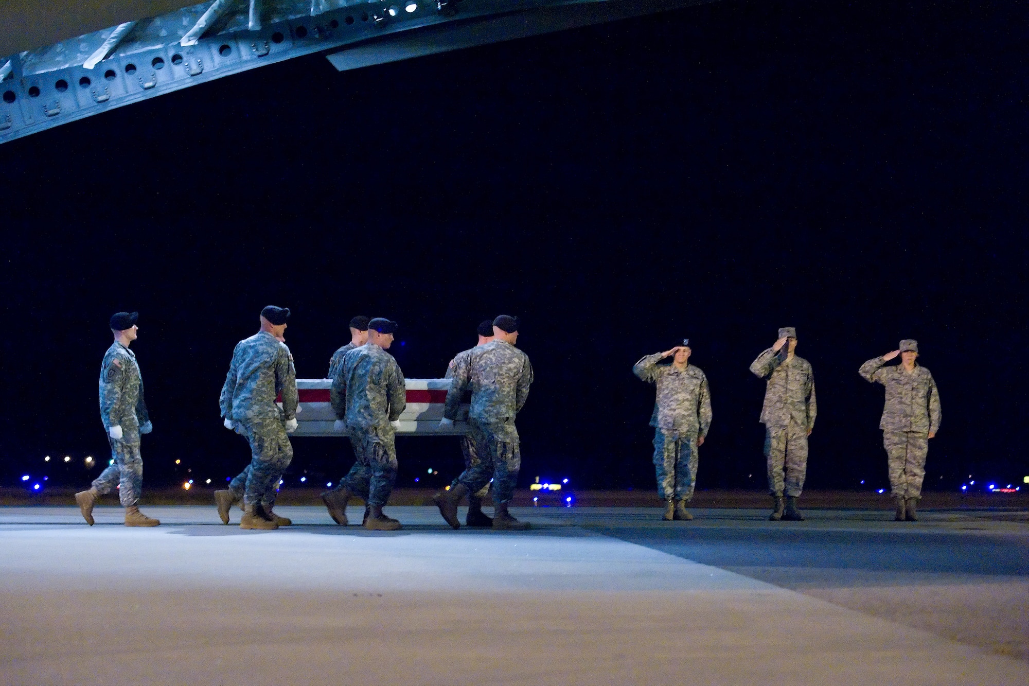 A U.S. Army carry team transfers the remains of Army Spc. Morganne M. McBeth, of Fredricksburg, Va., at Dover Air Force Base, Del., July 4. Spc. McBeth was assigned to the 1st Special Troops Battalion, 1st Brigade Combat Team, 82nd Airborne Division, Fort Bragg, N.C.. (U.S. Air Force photo/Roland Balik)