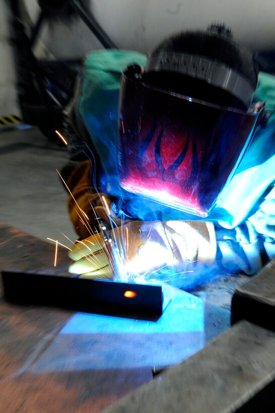 ELLSWORTH AIR FORCE BASE, S.D. – Airman 1st Class James Chazotte, 28th Maintenance Squadron metals technology apprentice, performs metal inert-gas welding during a training session, July 16. Airmen in the metals tech shop train on a routine basis to maintain their skills. (U.S. Air Force photo/Airman 1st Class Matthew Flynn)
