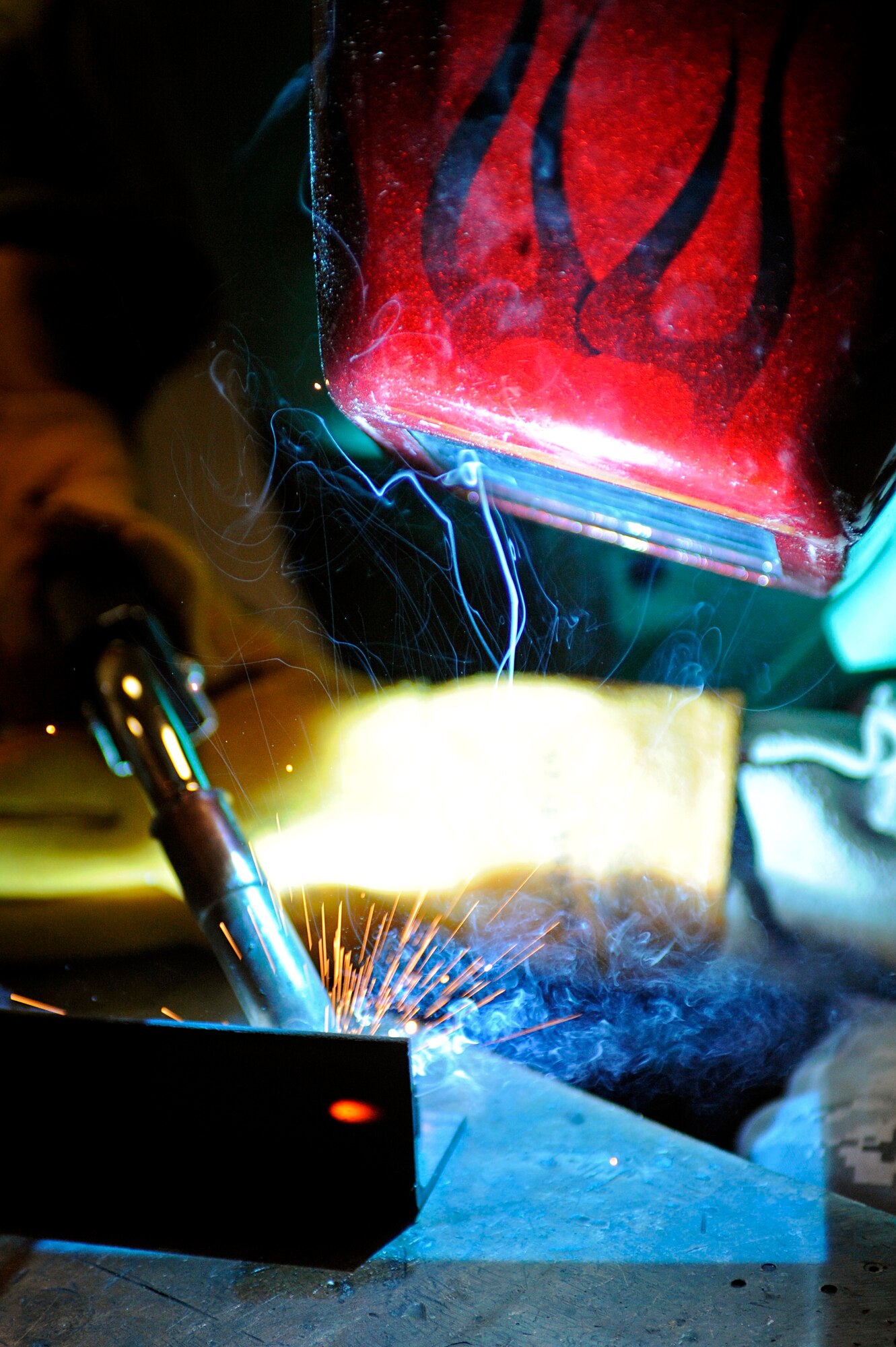 ELLSWORTH AIR FORCE BASE, S.D. – Airman 1st Class James Chazotte, 28th Maintenance Squadron metals technology apprentice, performs metal inert-gas welding during a training session, July 16. MIG welding is a form of welding used mainly for aerospace ground equipment. (U.S. Air Force photo/Airman 1st Class Matthew Flynn)