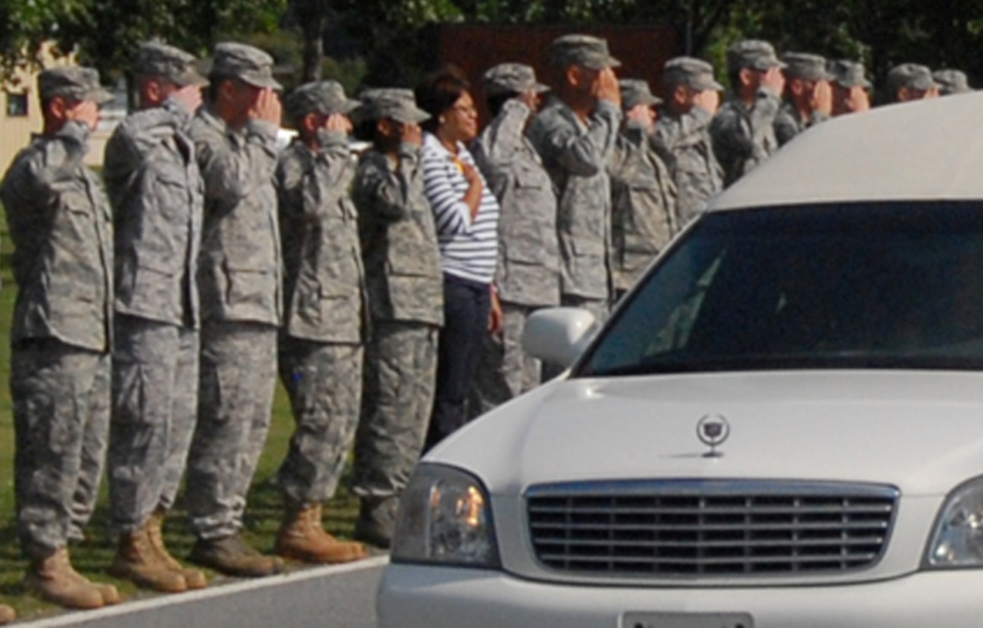 Military and civilian members of Team Robins line Robins Parkway and render respects during the dignified transfer of Marine Lance Corporal Daniel Raney.
Corporal Raney died July 9 while supporting combat operations in Afghanistan.
U. S. Air Force Photo by TSgt. Vannie Miller
