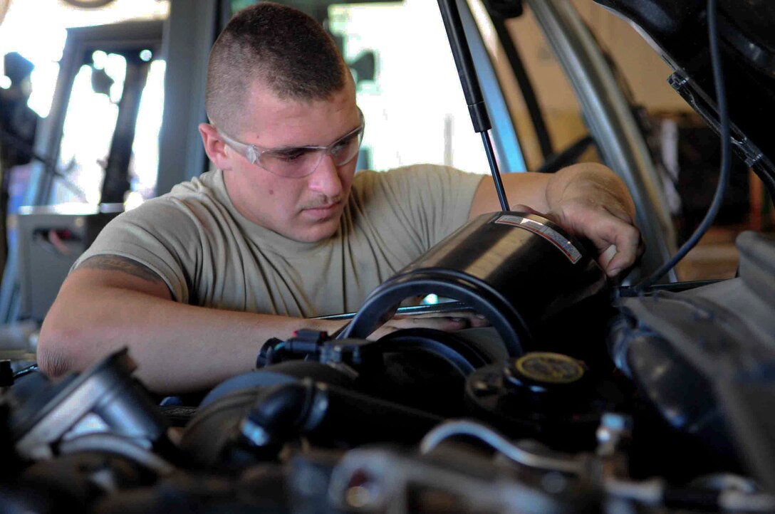 ELLSWORTH AIR FORCE BASE, S.D. – Airman 1st Class Rodney Lewis, 28th Logistics Readiness vehicle and vehicular equipment maintenance journeyman, replaces the air filter on a bobtail truck, July 16. Airman Lewis is preparing the bobtail for the upcoming operational readiness exercise. (U.S. Air Force Photo/Airman 1st Class Corey Hook)