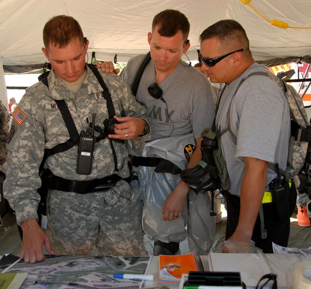 1st Lt Joseph Meller,  extraction executive officer of the 836th Sapper Company from Kingsville, Texas, looks over the site map with several Soldiers during domestic operations portion of the Patriot Exercise 2010 in Volk Field, Wis., July 15. The Patriot Exercise is an international annual training event sponsored by the National Guard Bureau held in July at Volk Field and Fort McCoy, Wis. to increase domestic and combat readiness and capabilities of National Guard units.