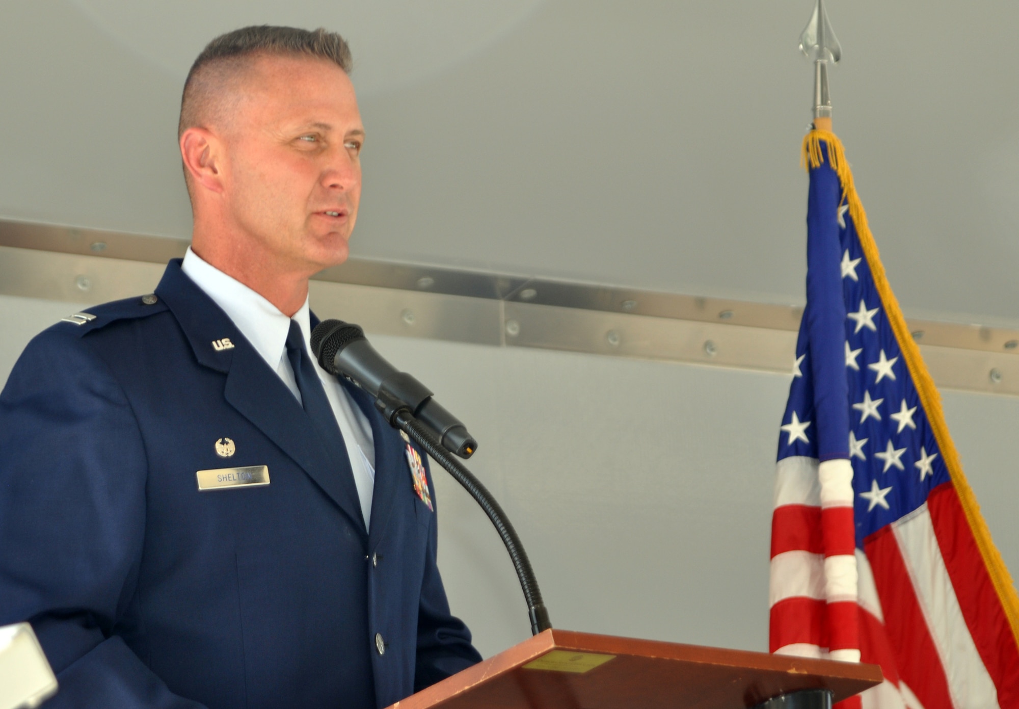 Capt. Collin "Bo" Shelton, 302nd Aircraft Maintenance Squadron commander, addresses the crowd after assuming command of the unit July 11 during a cereromy at Peterson Air Force Base, Colo. (U.S. Air Force photo/Tech. Sgt. Daniel Butterfield)