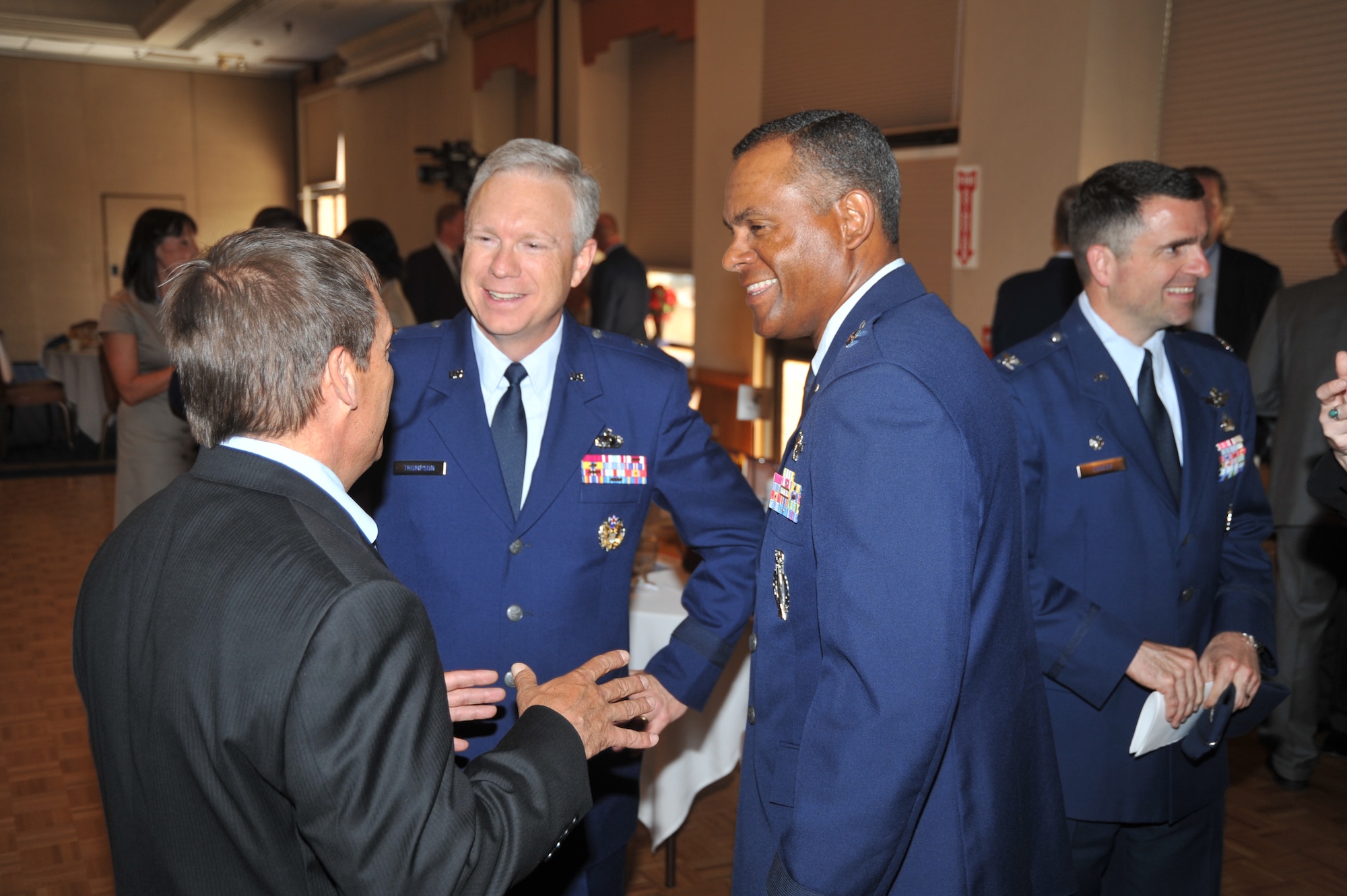 John Garcia, director of Albuquerque Economic Development Department, has a conversation with Brig. Gen. John Thompson, Air Force Program Executive Officer for Strategic Systems, and Brig. Gen. Everett Thomas, Air Force Nuclear Weapons Center commander.  U.S. Air Force Photo by Todd Berenger.