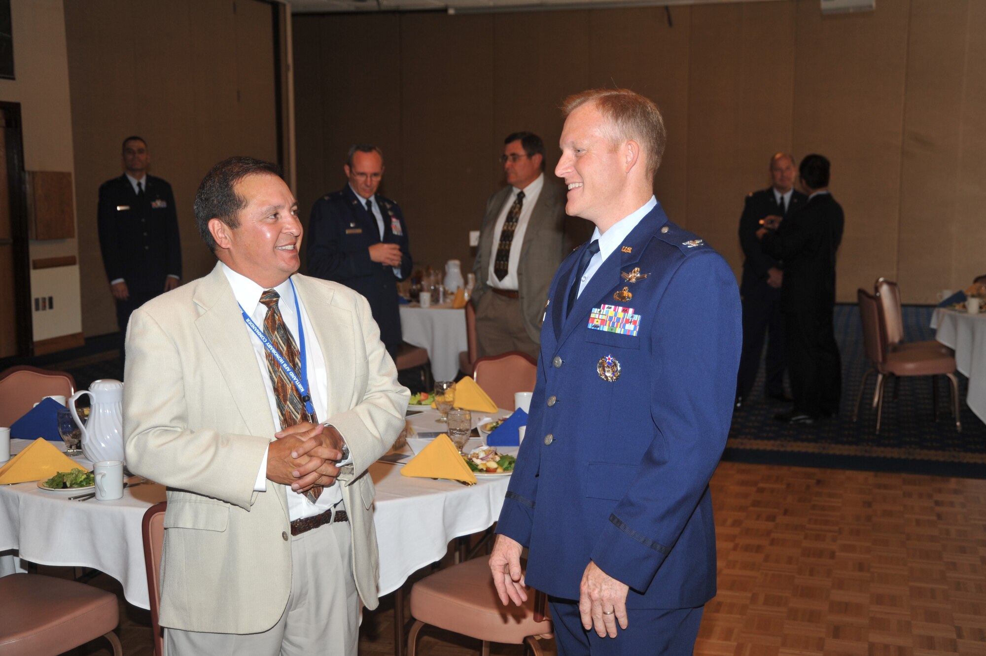 Col. Michael Moran, Space Development and Test Wing commander, talks to Louis Herrera, president, Sisttemex, Inc., and honorary commander for the Space Development Group, before the ceremony.  U.S. Air Force Photo by Todd Berenger.